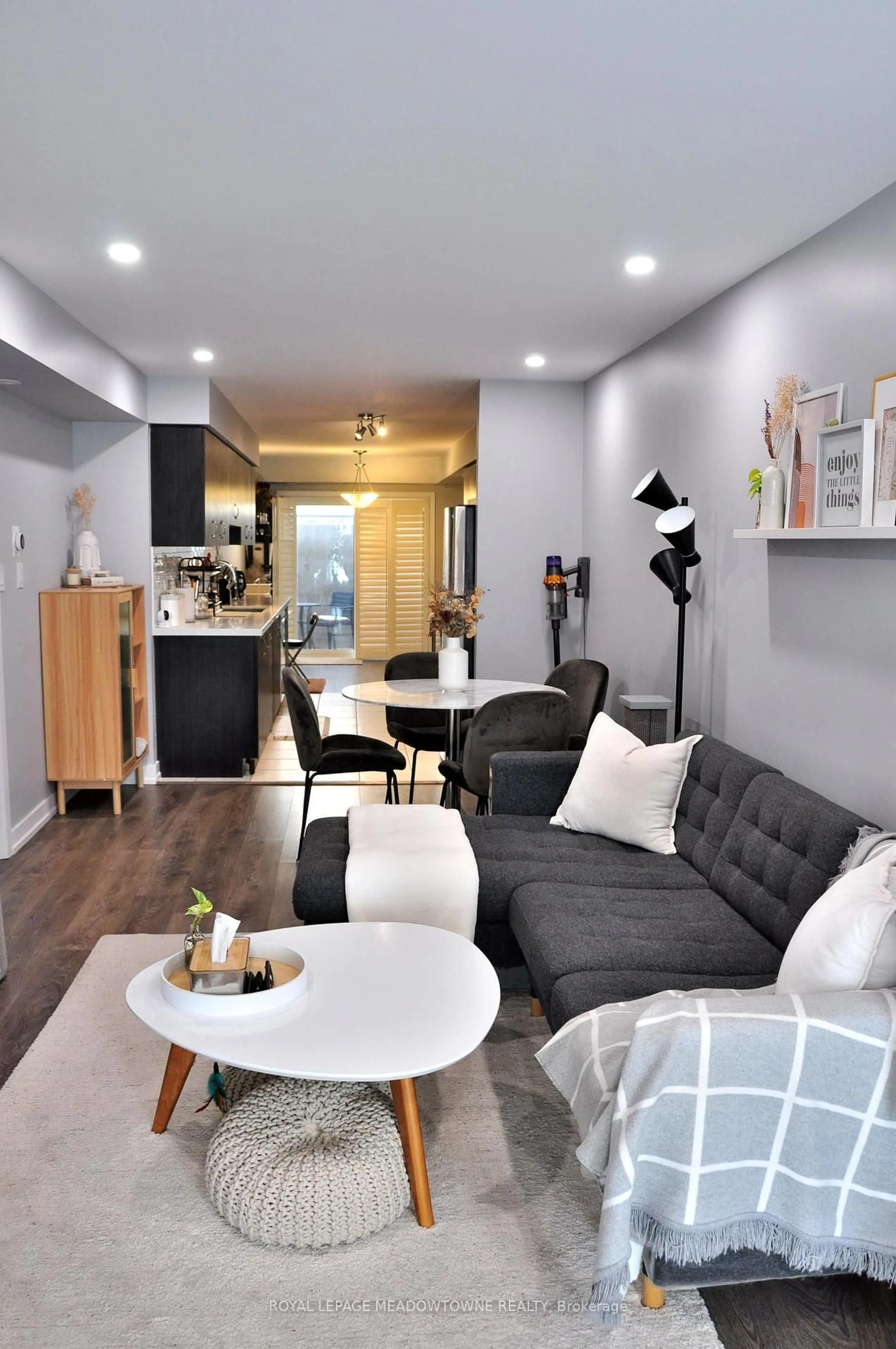 Living room with furniture, wood/laminate floor for 60 Parrotta Dr #251, Toronto Ontario M9M 0E5