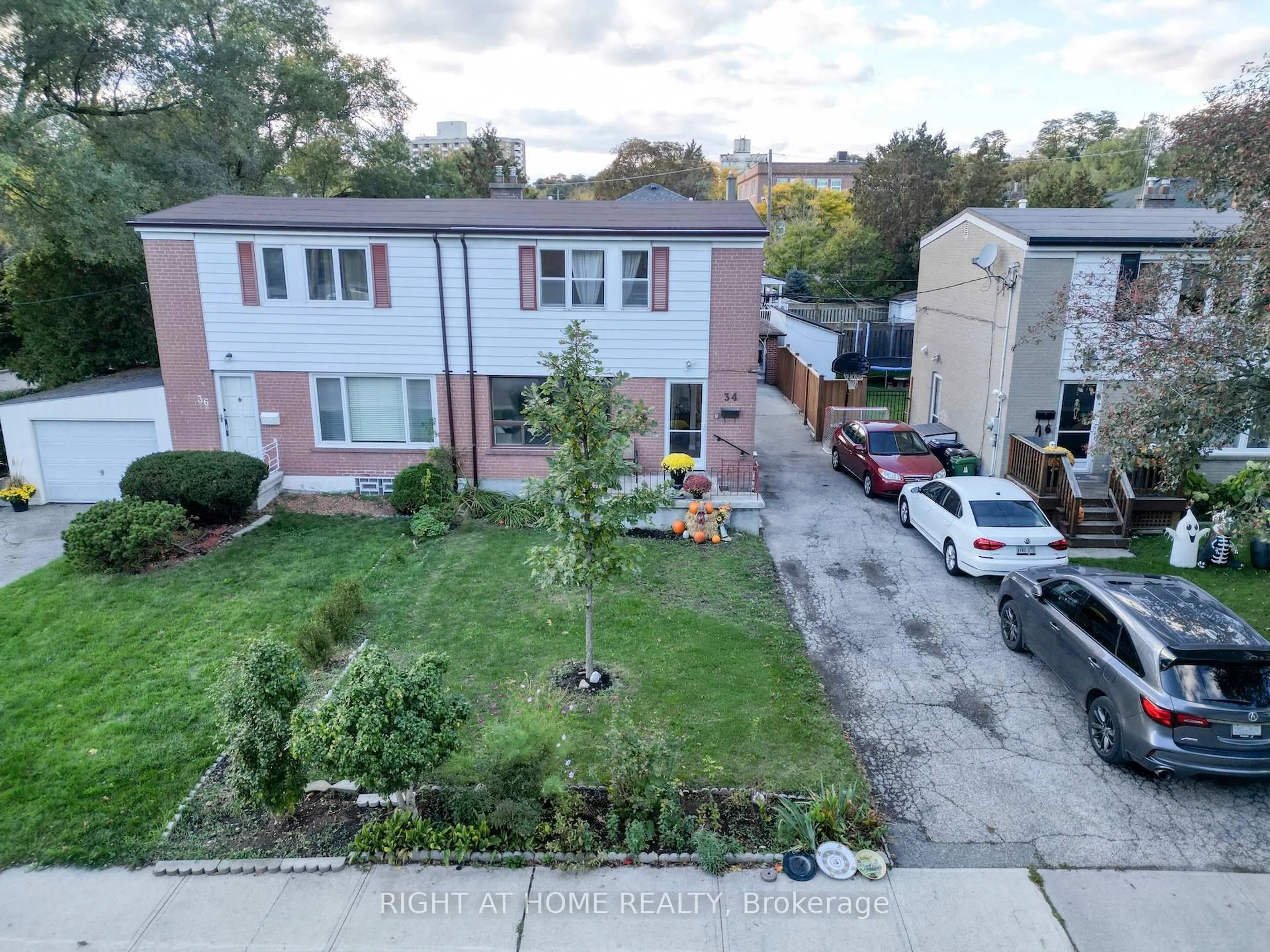 A pic from outside/outdoor area/front of a property/back of a property/a pic from drone, street for 34 Althea Rd, Toronto Ontario M6S 2P2