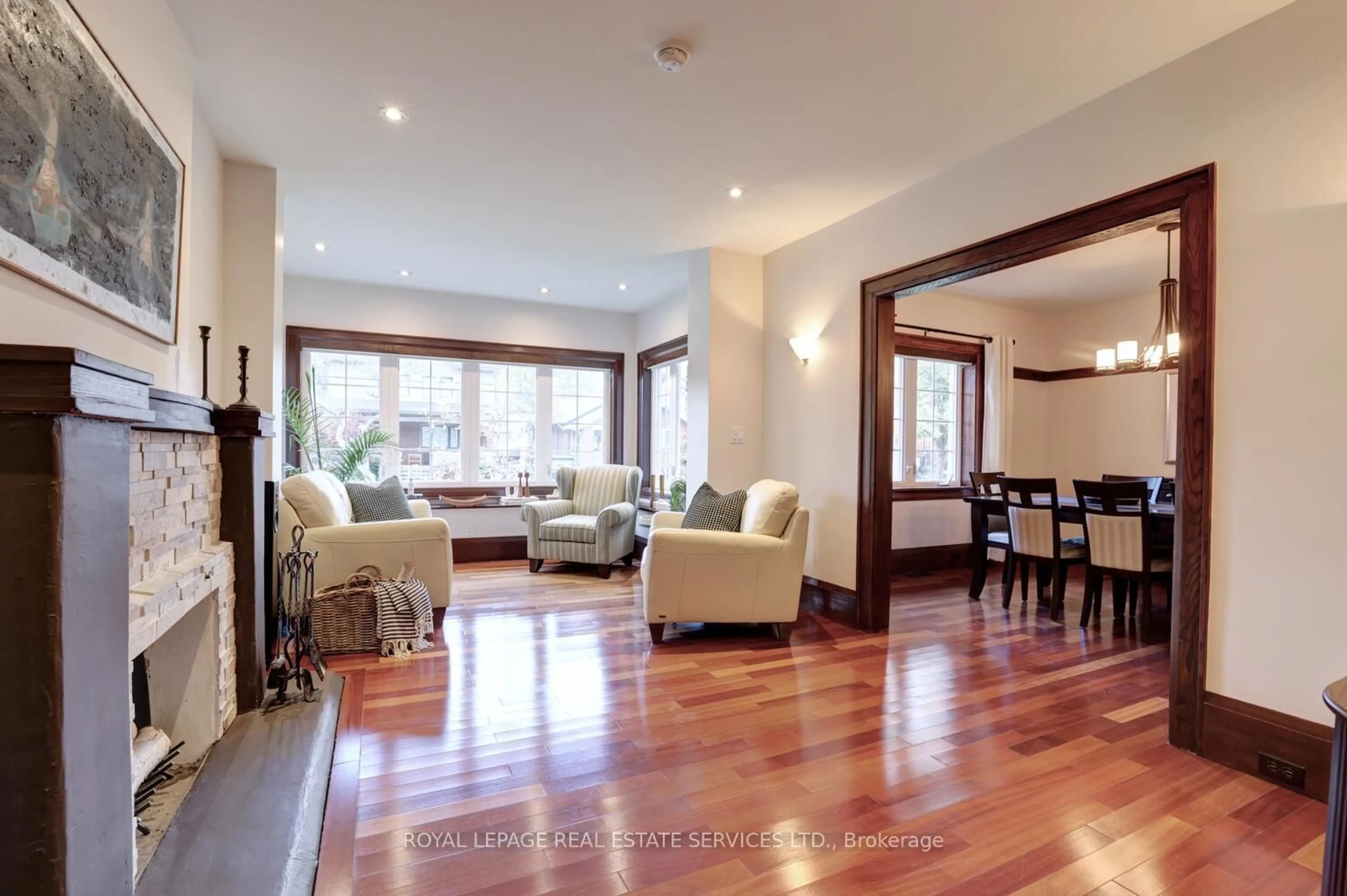 Living room with furniture, wood/laminate floor for 63 Eastbourne Cres, Toronto Ontario M8V 1W7