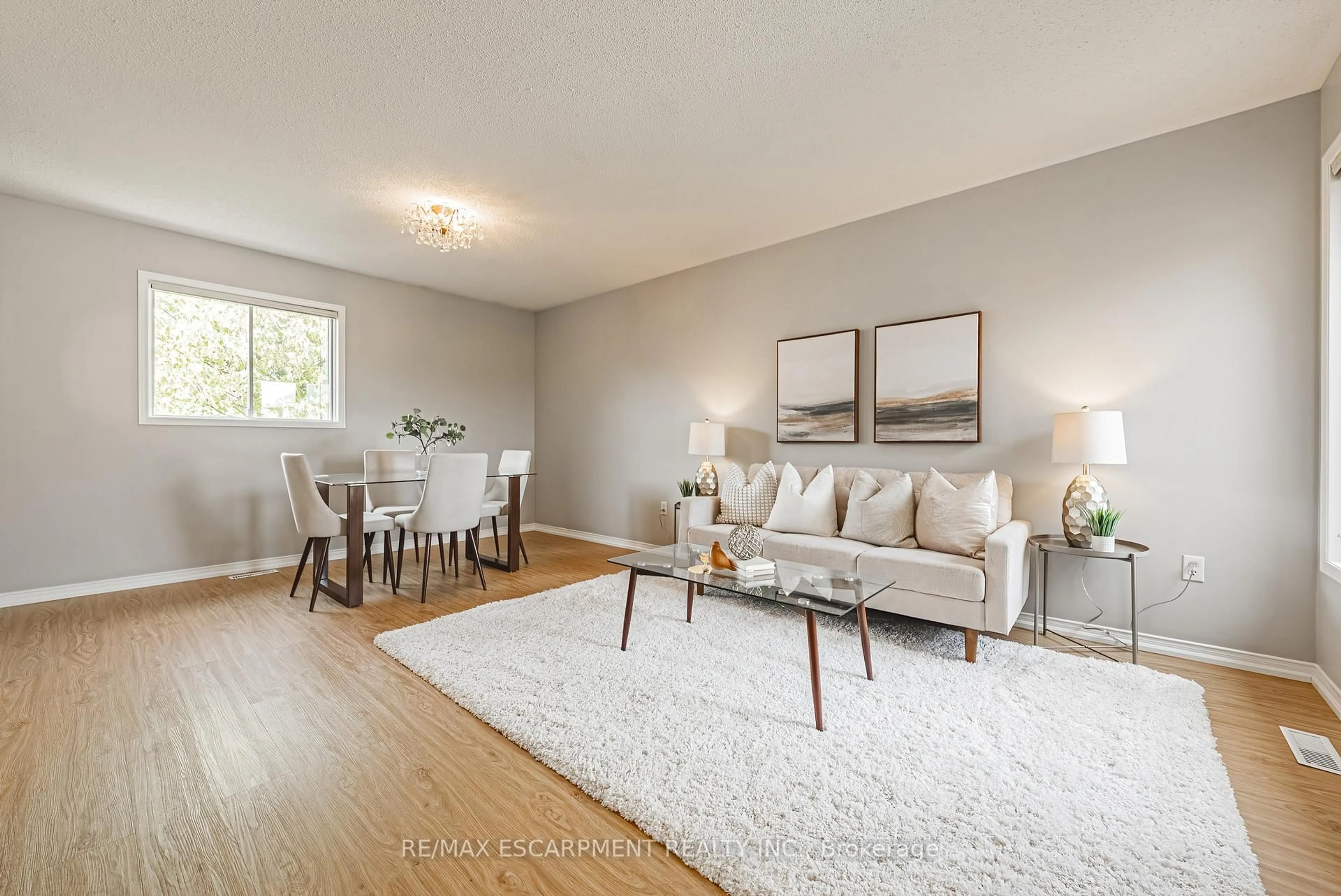 Living room with furniture, wood/laminate floor for 12 Summerfield Cres, Brampton Ontario L6X 4L3