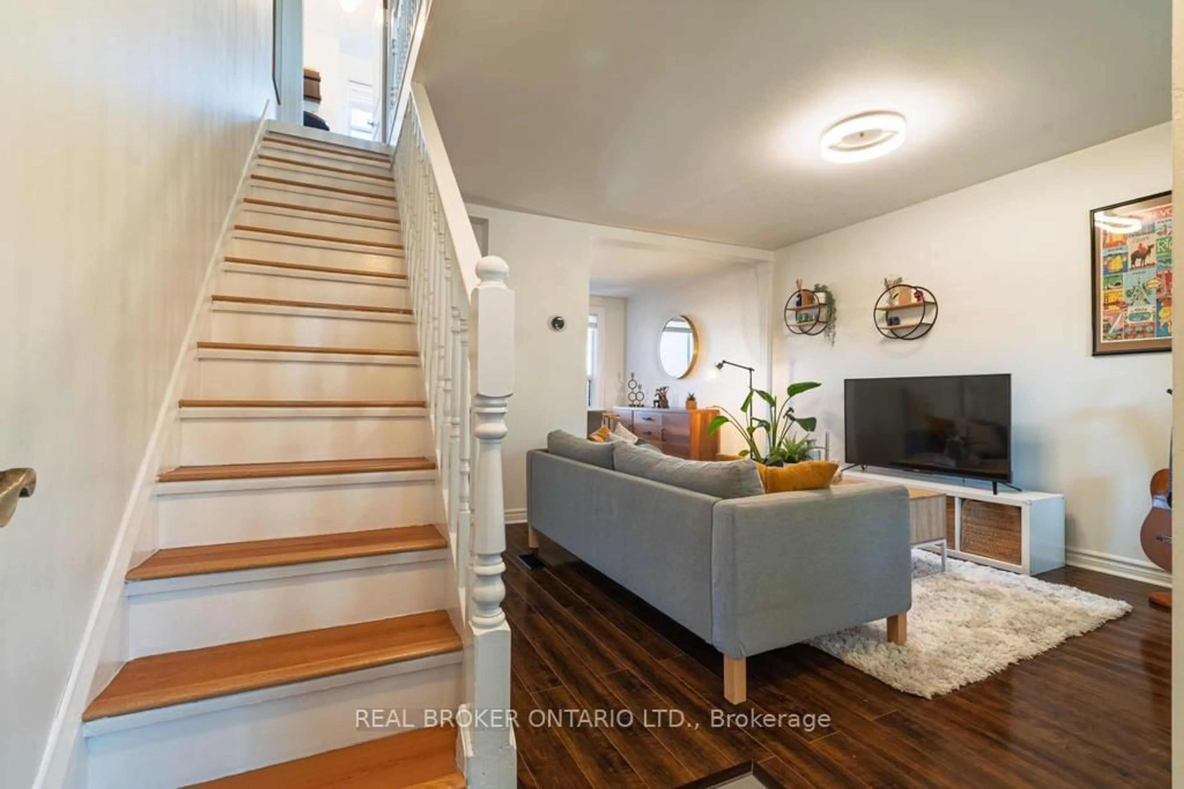 Living room with furniture, wood/laminate floor for 204 Earlscourt Ave, Toronto Ontario M6E 4B1