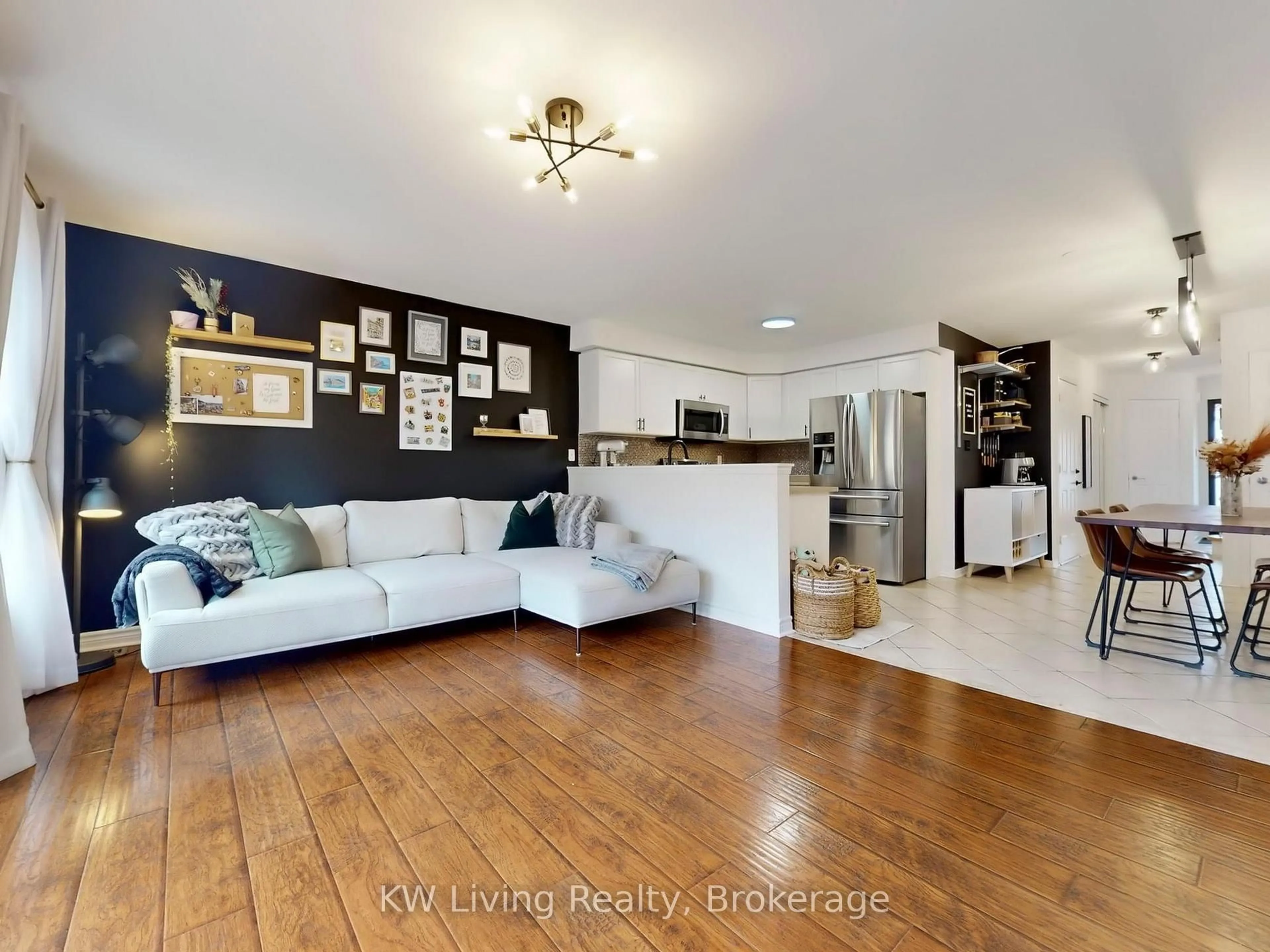 Living room with furniture, wood/laminate floor for 759 Gleeson Rd, Milton Ontario L9T 0C1