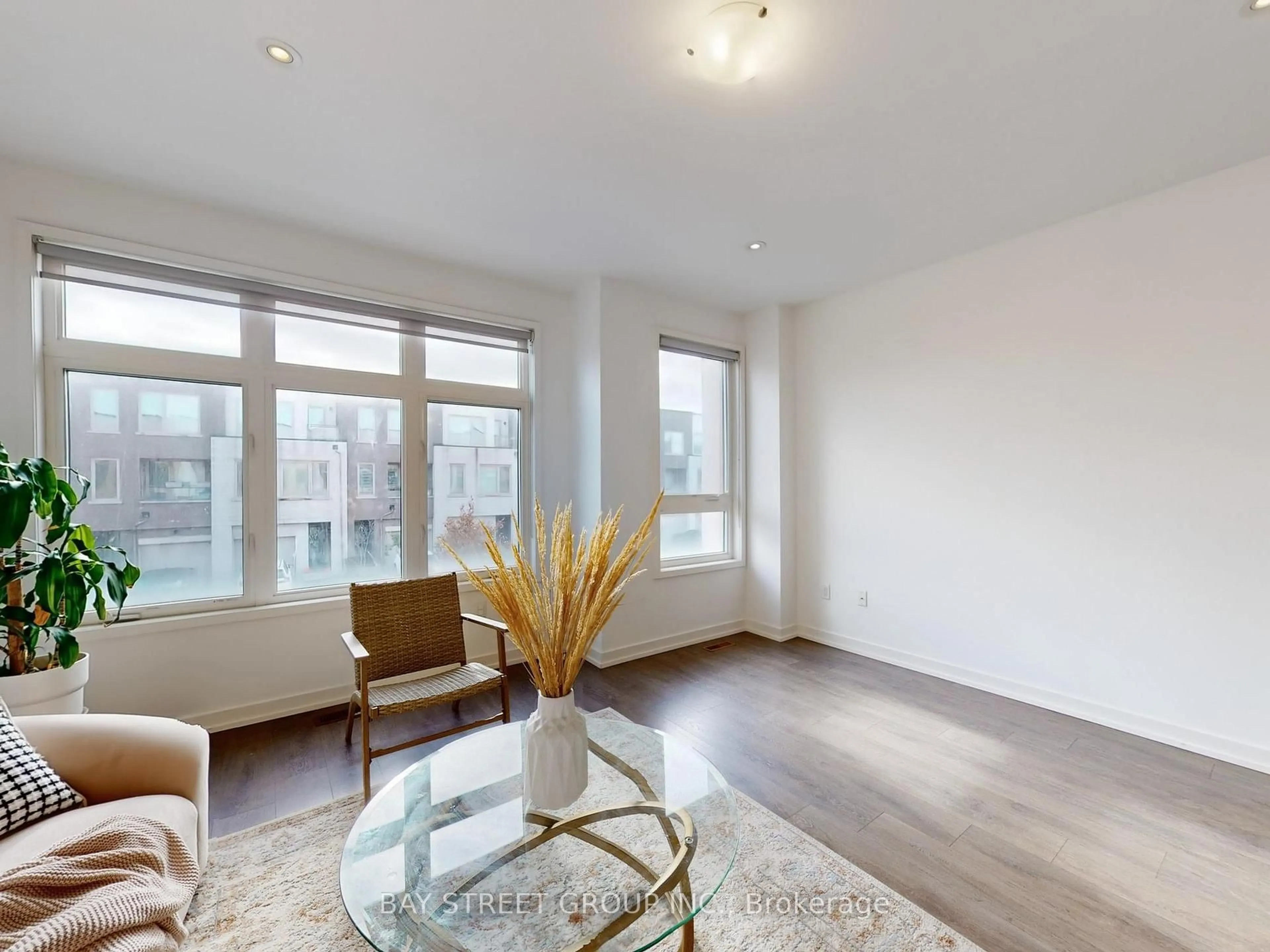 Living room with furniture, wood/laminate floor for 219 Huguenot Rd, Oakville Ontario L6H 7C3