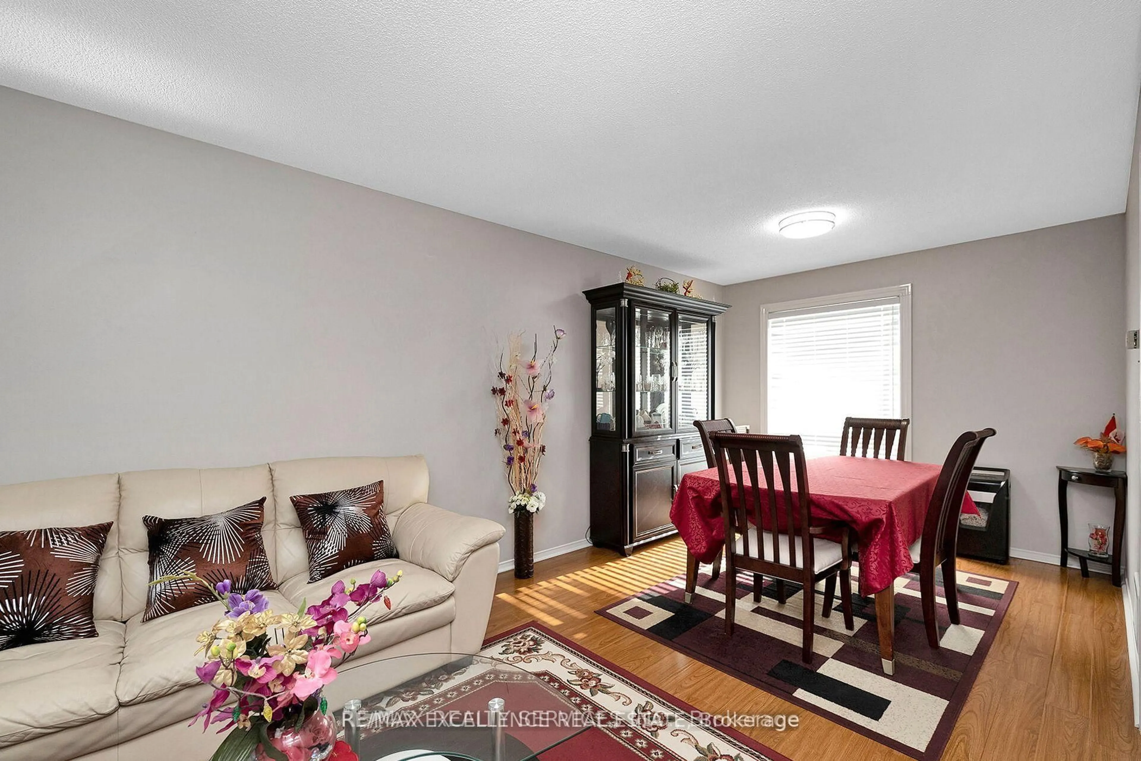 Living room with furniture, wood/laminate floor for 71 Rocky Mountain Cres, Brampton Ontario L6R 1E7