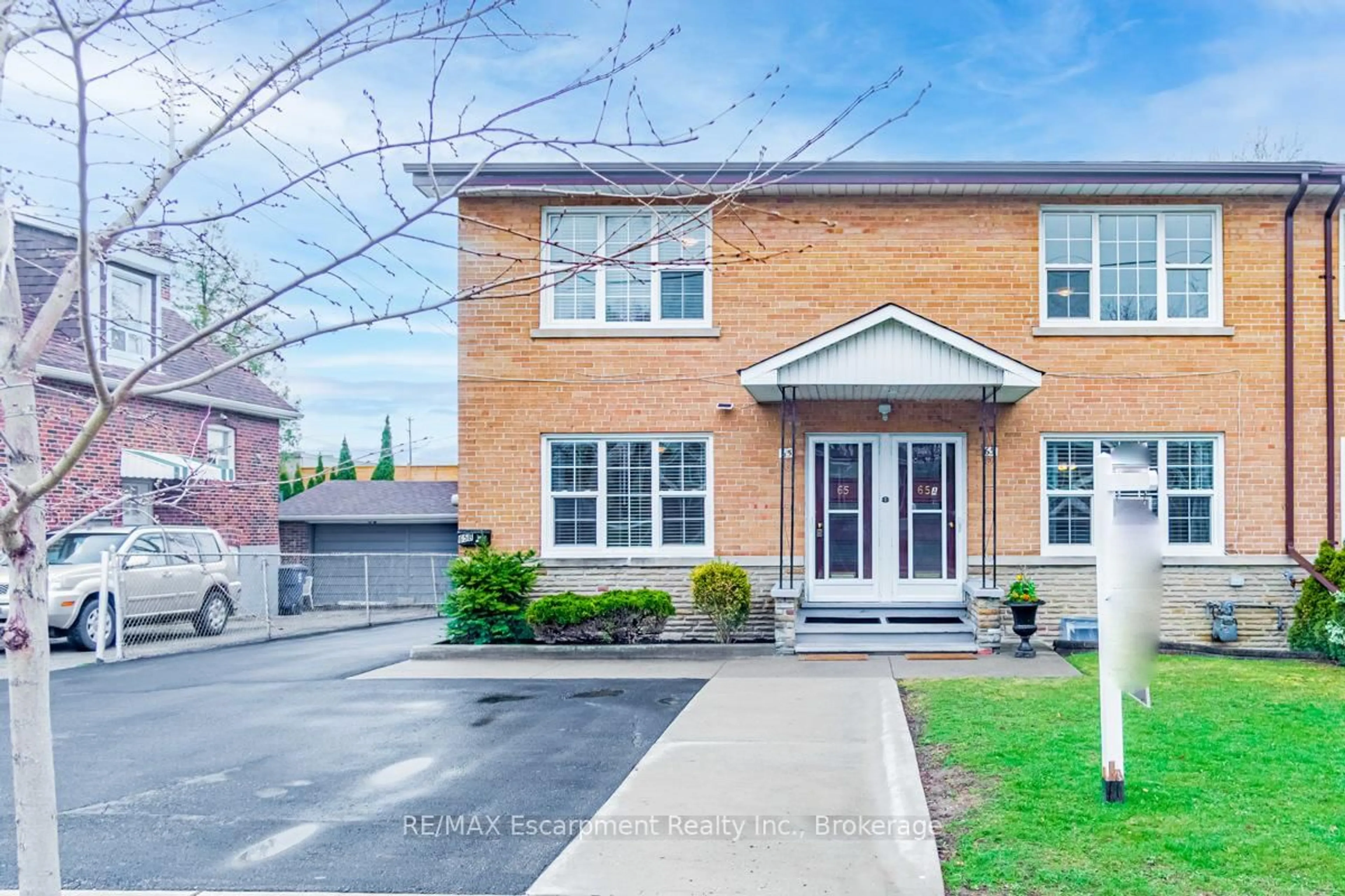 Home with brick exterior material, street for 65 Fairfield Ave, Toronto Ontario M8W 1R6