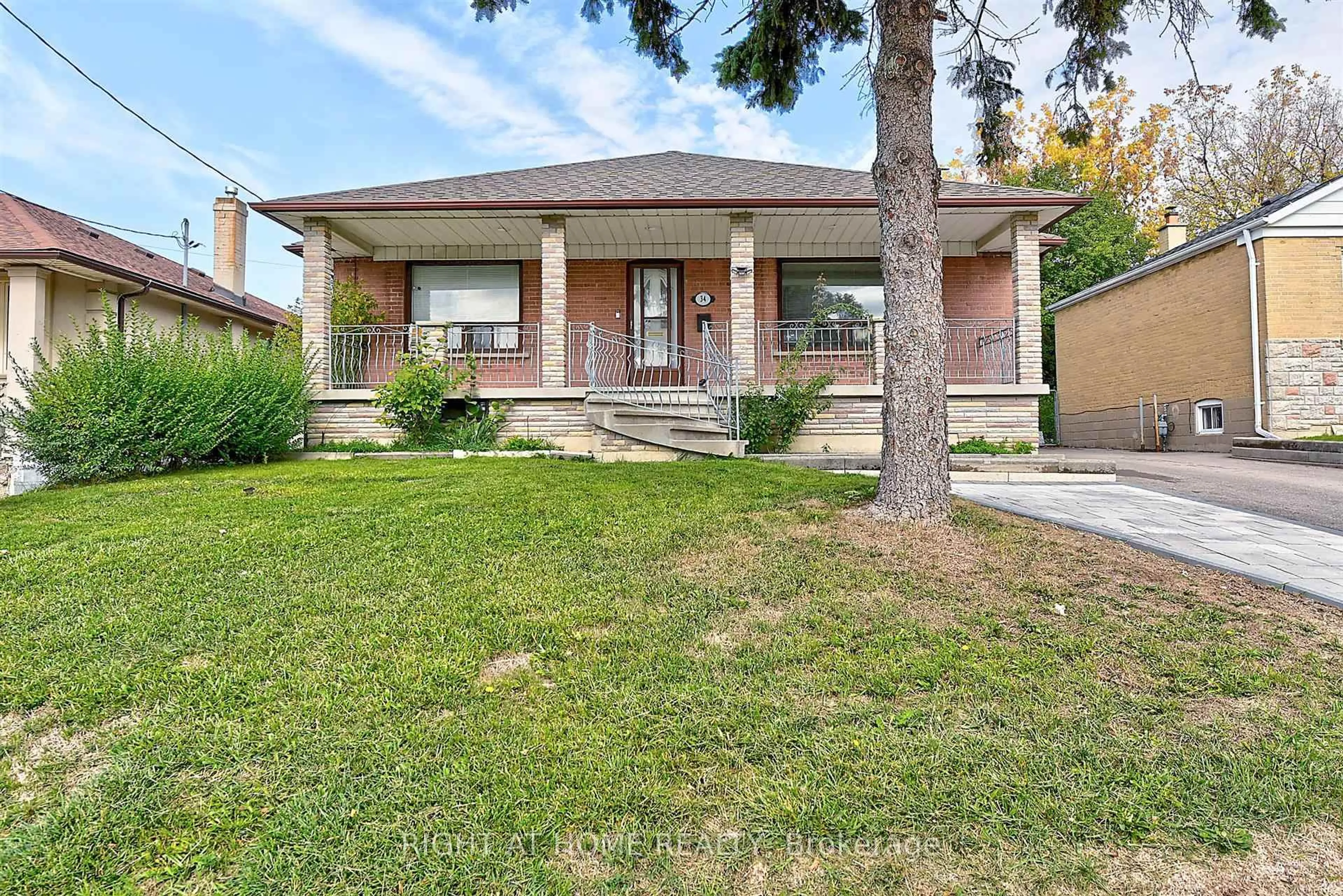 Home with brick exterior material, street for 34 William Cragg Dr, Toronto Ontario M3M 1T9