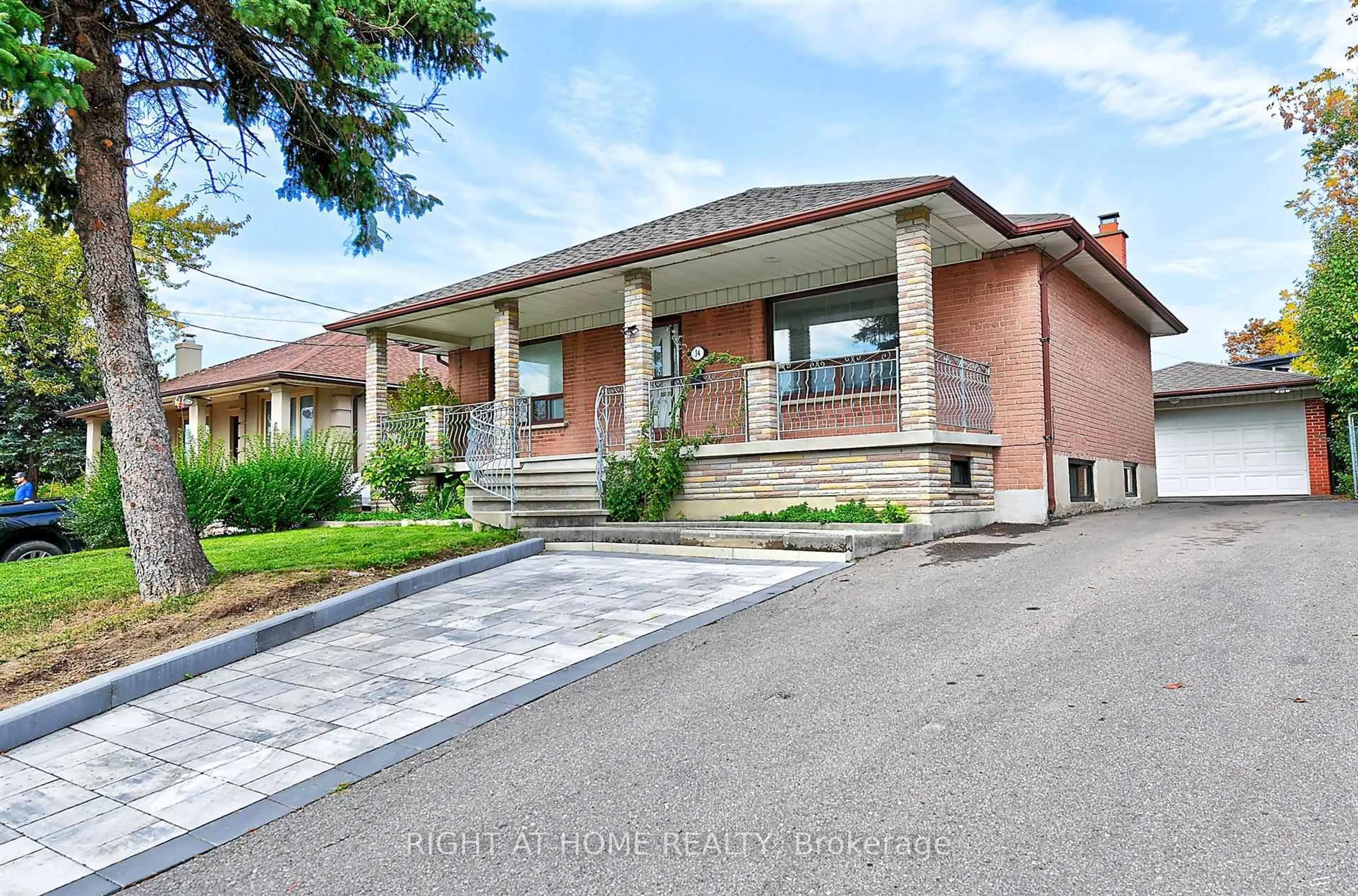 Home with brick exterior material, street for 34 William Cragg Dr, Toronto Ontario M3M 1T9