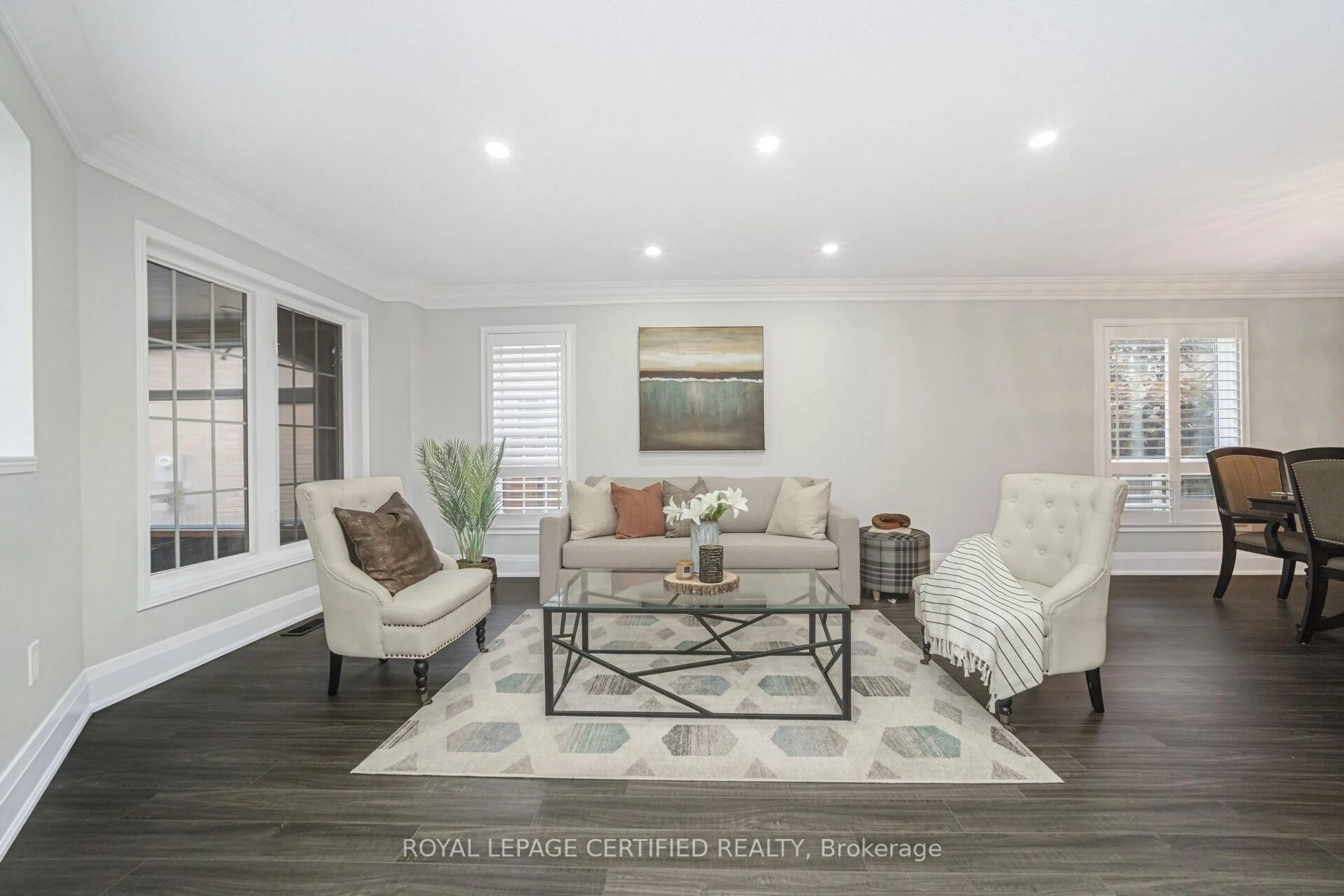 Living room with furniture, wood/laminate floor for 57 Legend Lane, Brampton Ontario L6X 5B6