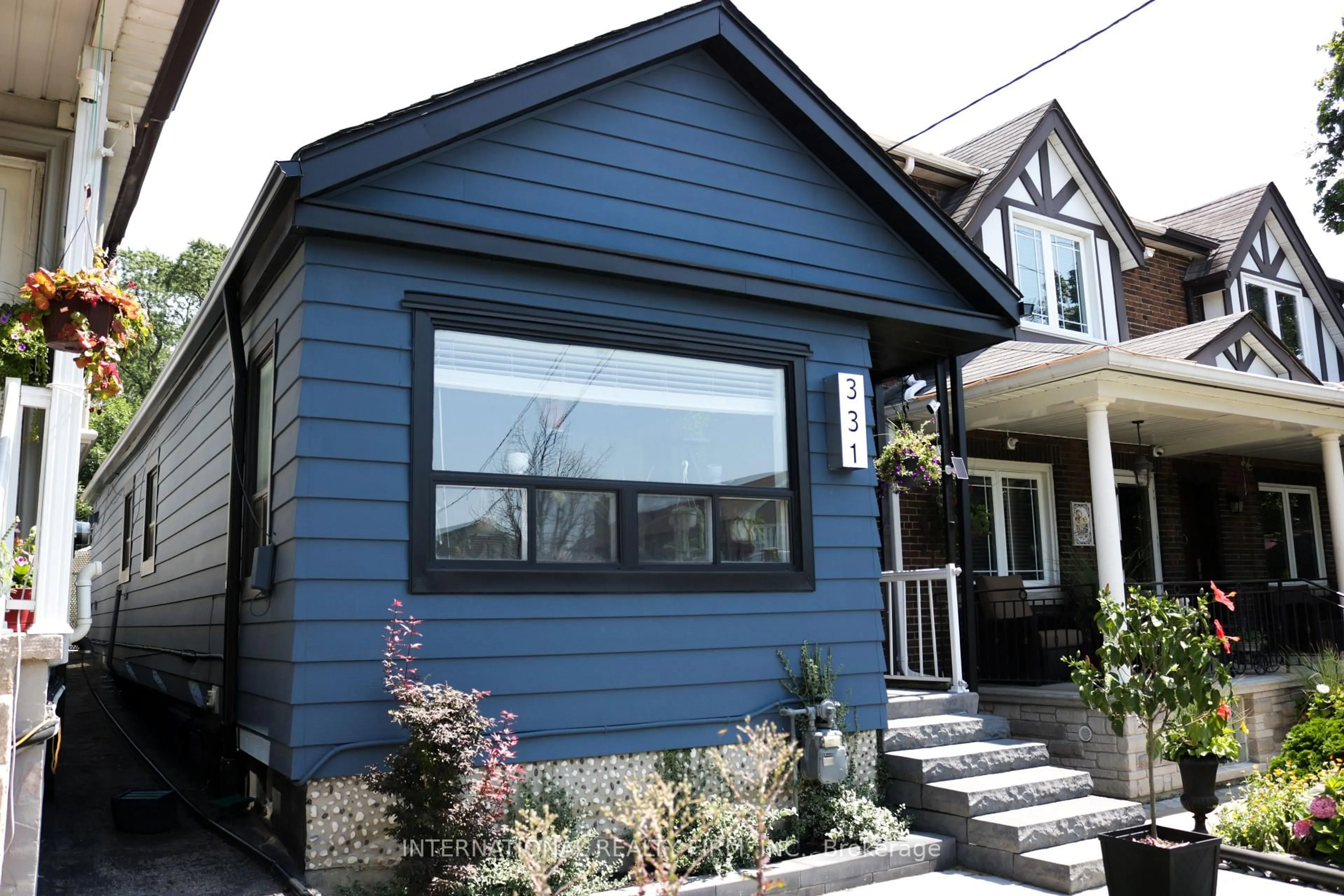 Home with vinyl exterior material, street for 331 Mcroberts Ave, Toronto Ontario M6E 4R1