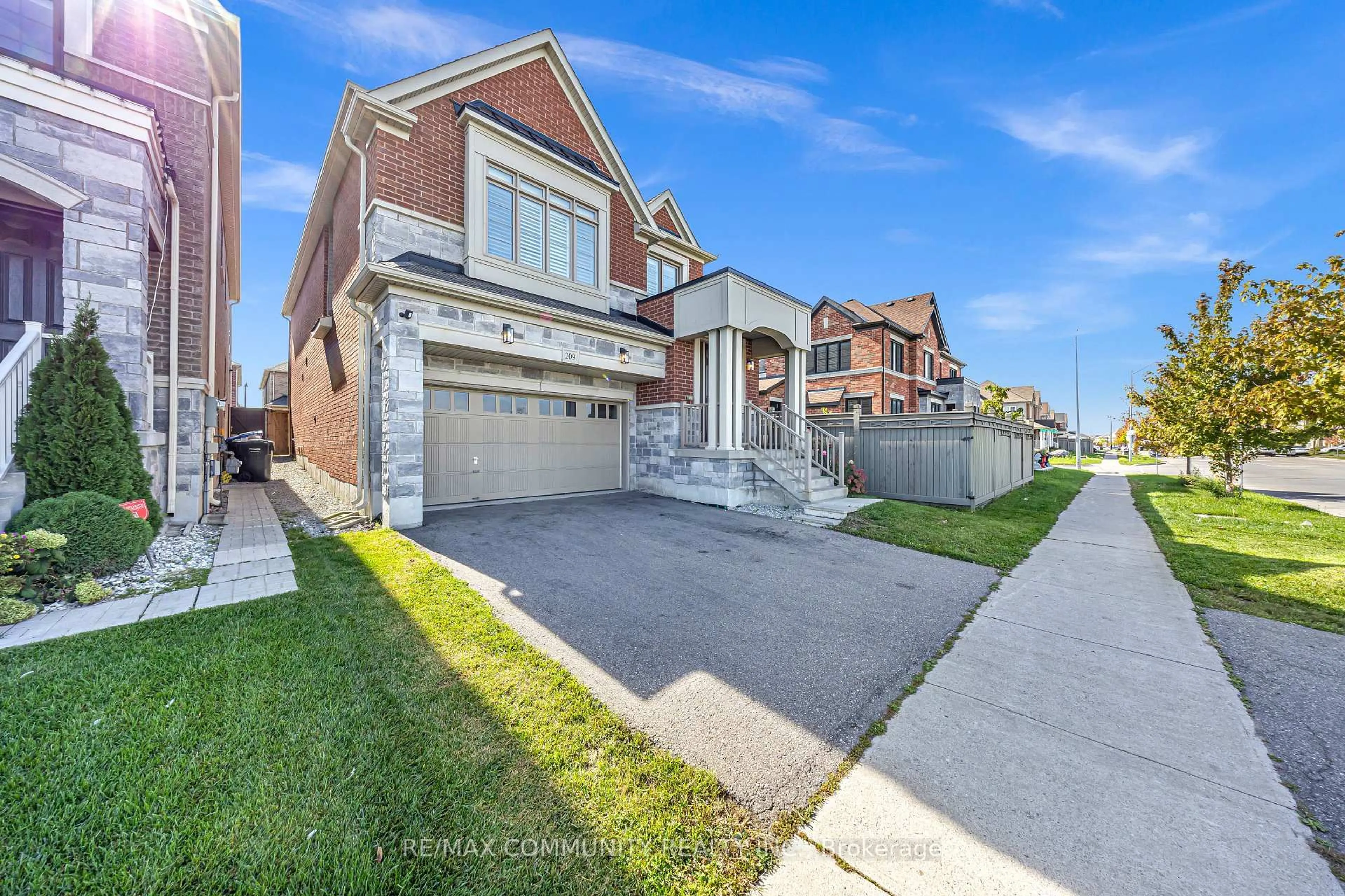 Home with brick exterior material, street for 209 Castle Oaks Crossing, Brampton Ontario L6P 3X3