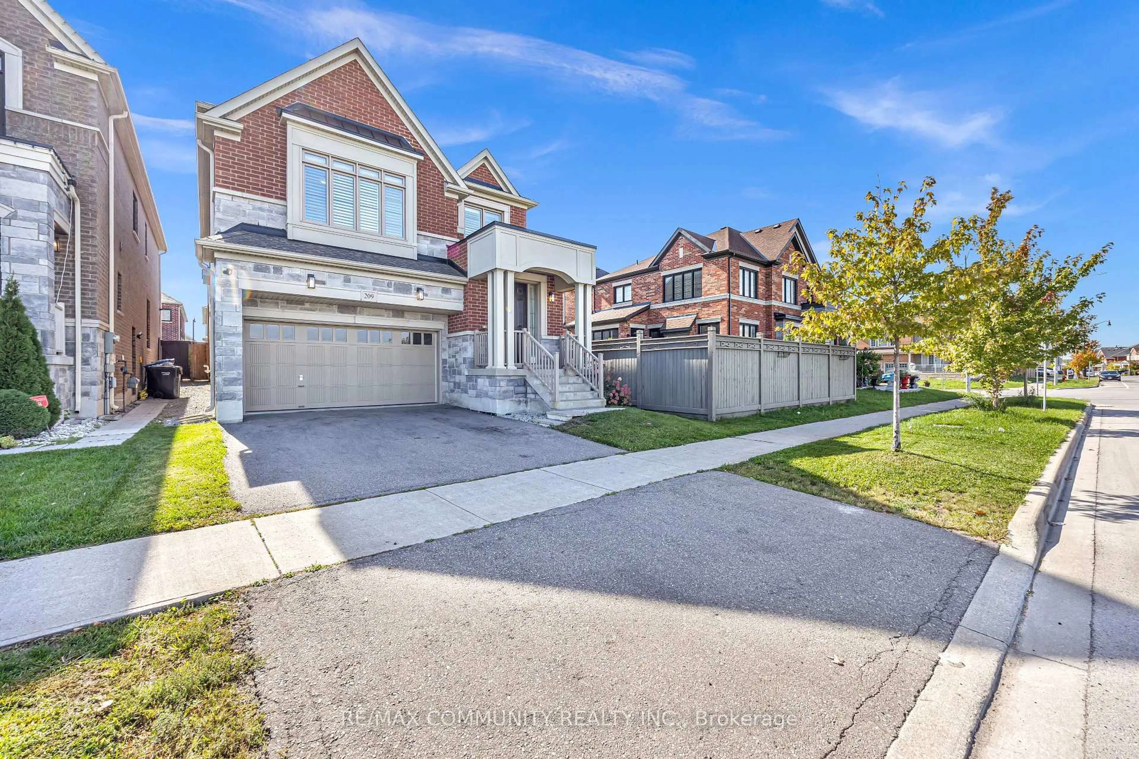 Home with brick exterior material, street for 209 Castle Oaks Crossing, Brampton Ontario L6P 3X3
