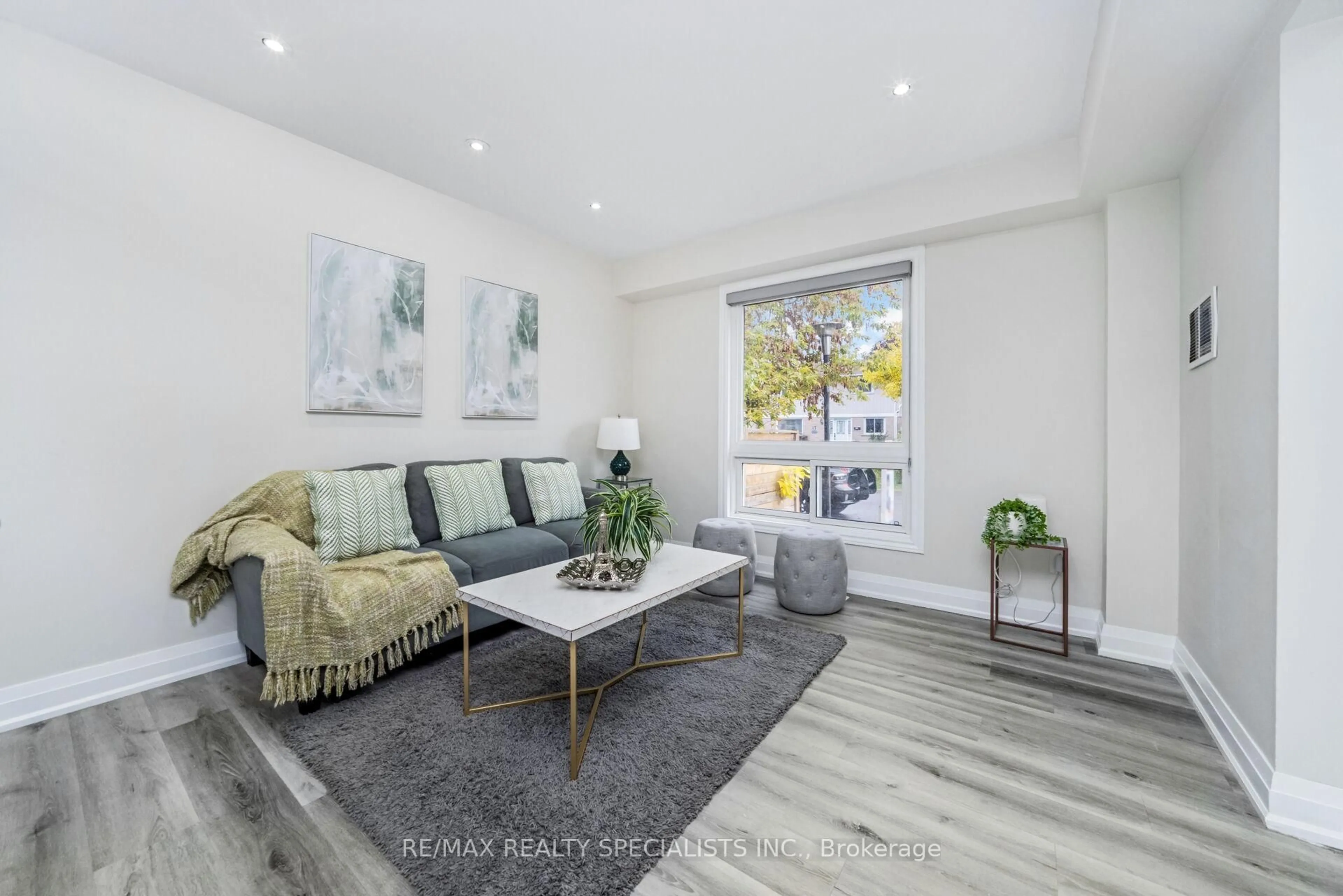 Living room with furniture, wood/laminate floor for 1 Golden Gate Dr, Brampton Ontario L6S 2K5