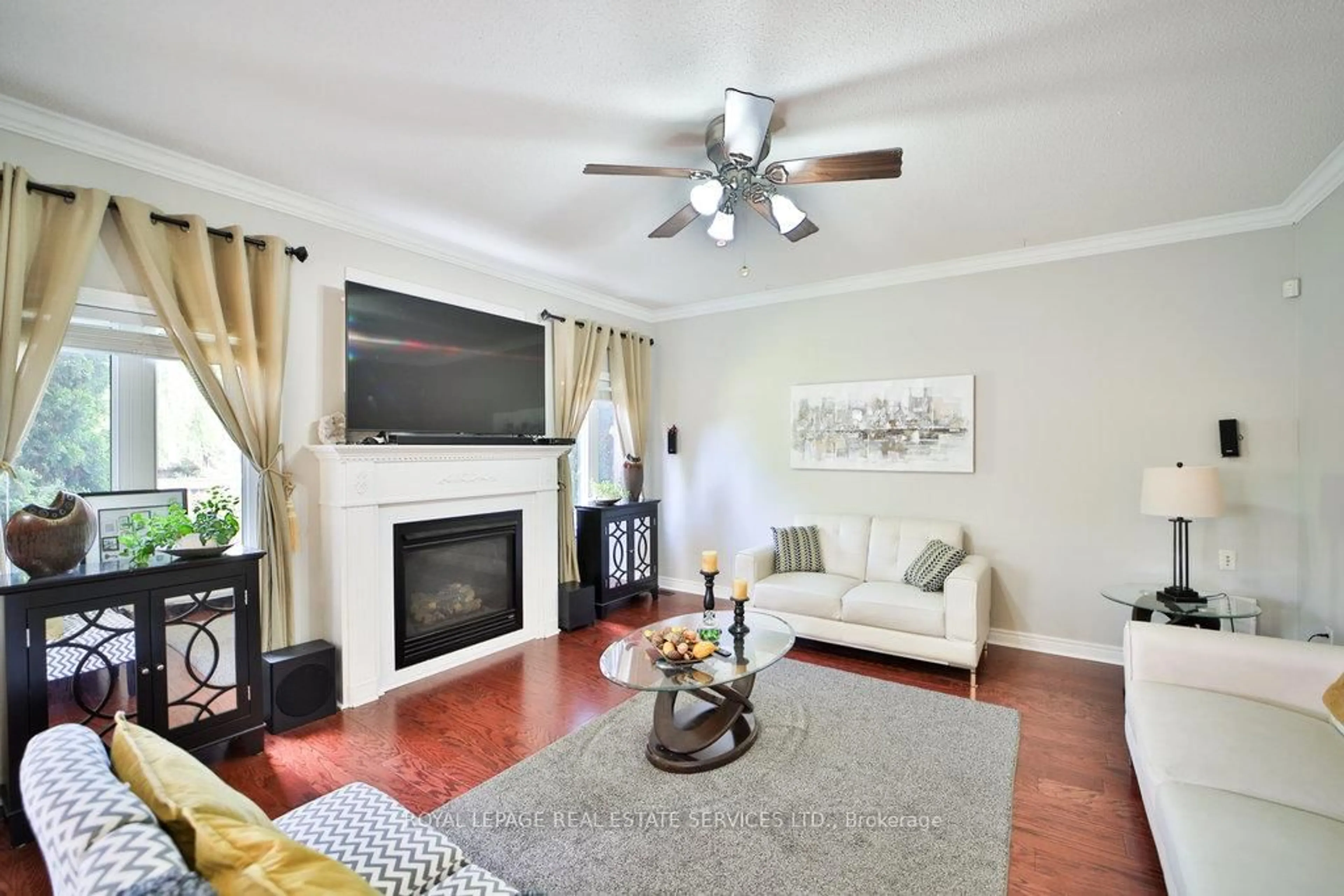 Living room with furniture, wood/laminate floor for 44 Game Creek Cres, Brampton Ontario L7A 0K3