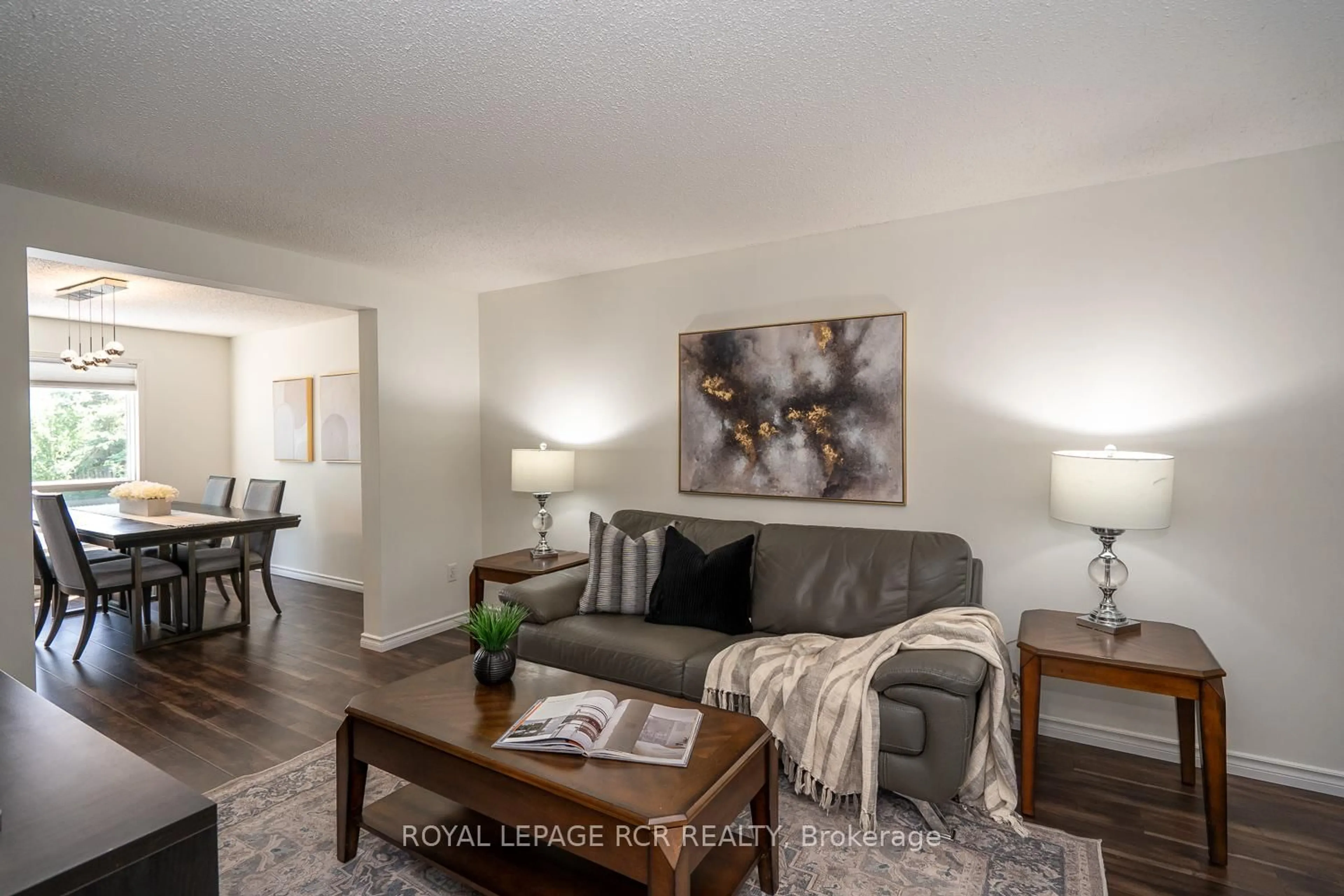 Living room with furniture, wood/laminate floor for 252 Elmwood Cres, Orangeville Ontario L9W 4T4