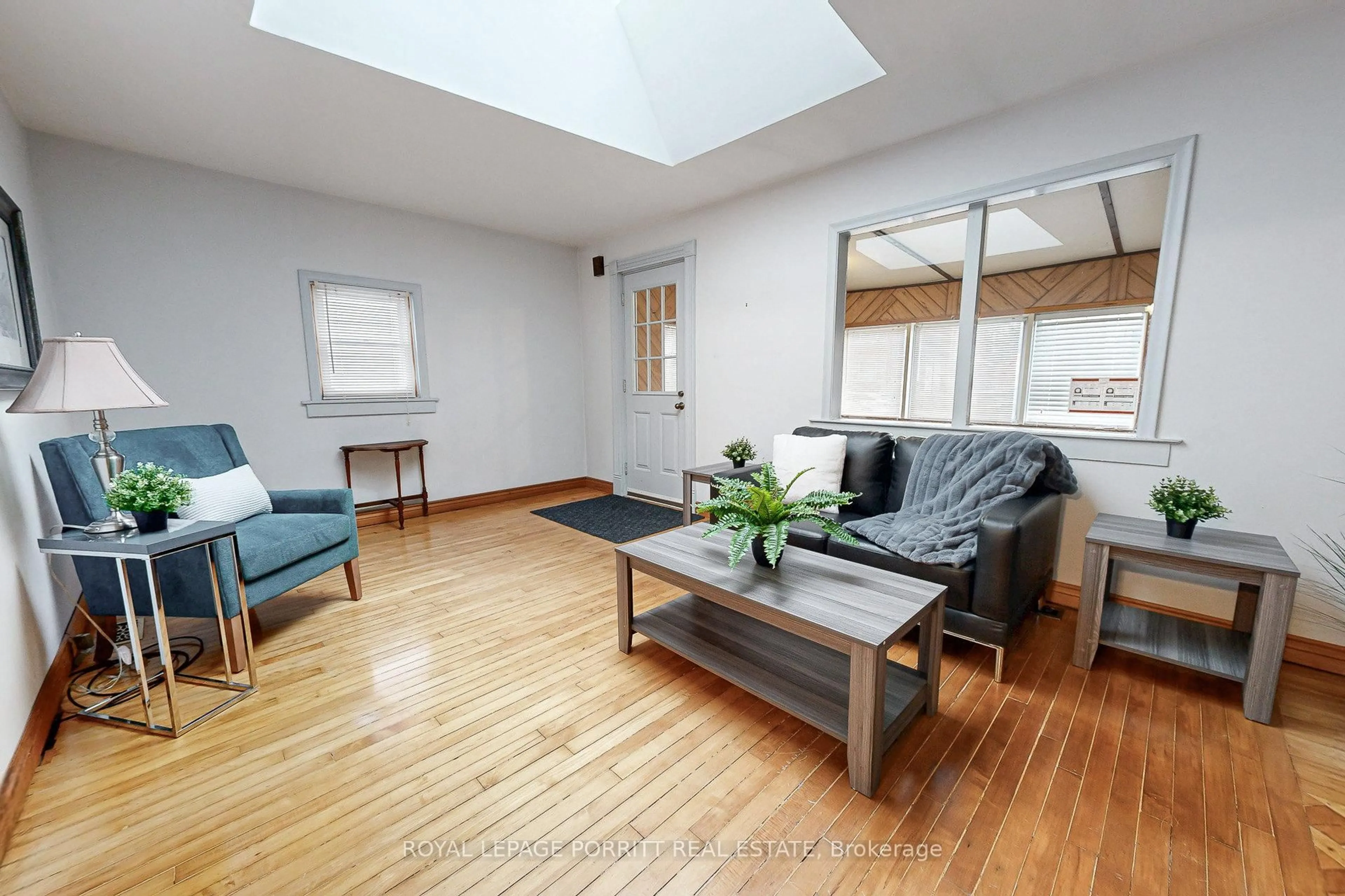 Living room with furniture, wood/laminate floor for 30 Thirtieth St, Toronto Ontario M8W 3B6
