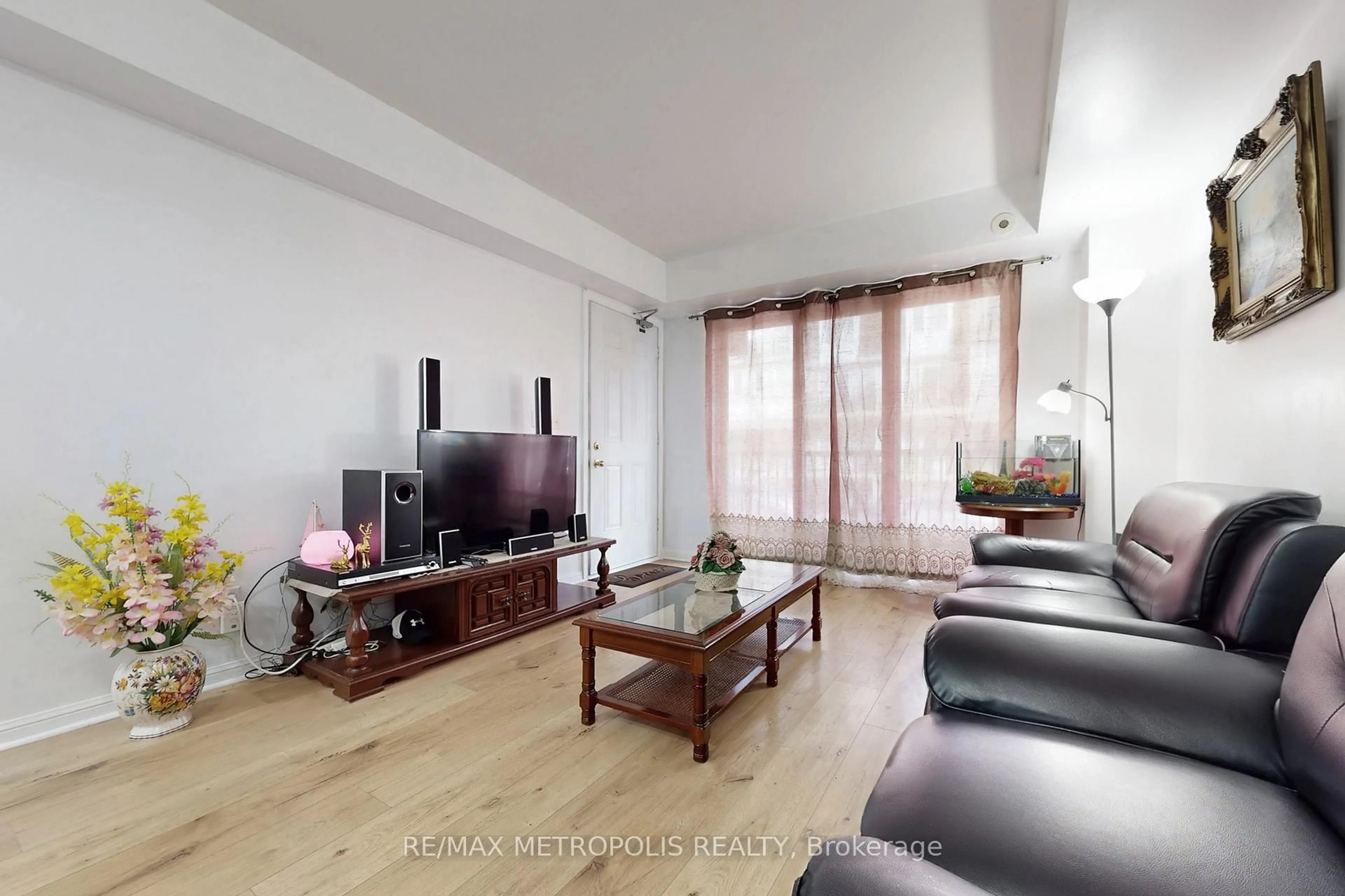 Living room with furniture, wood/laminate floor for 3043 Finch Ave #2025, Toronto Ontario M9M 0A4