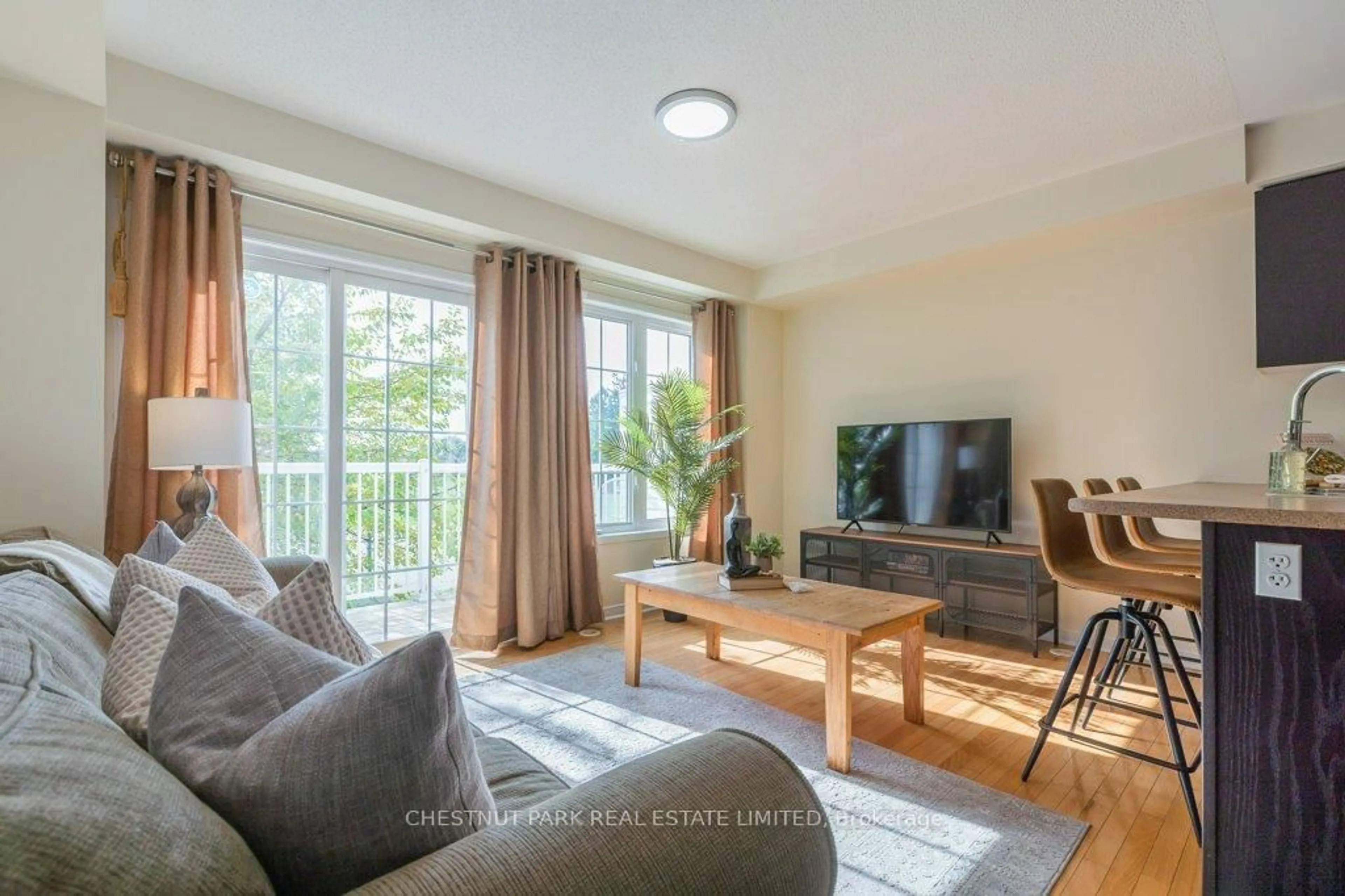 Living room with furniture, wood/laminate floor for 35 Mantello Dr, Toronto Ontario M3J 0H6