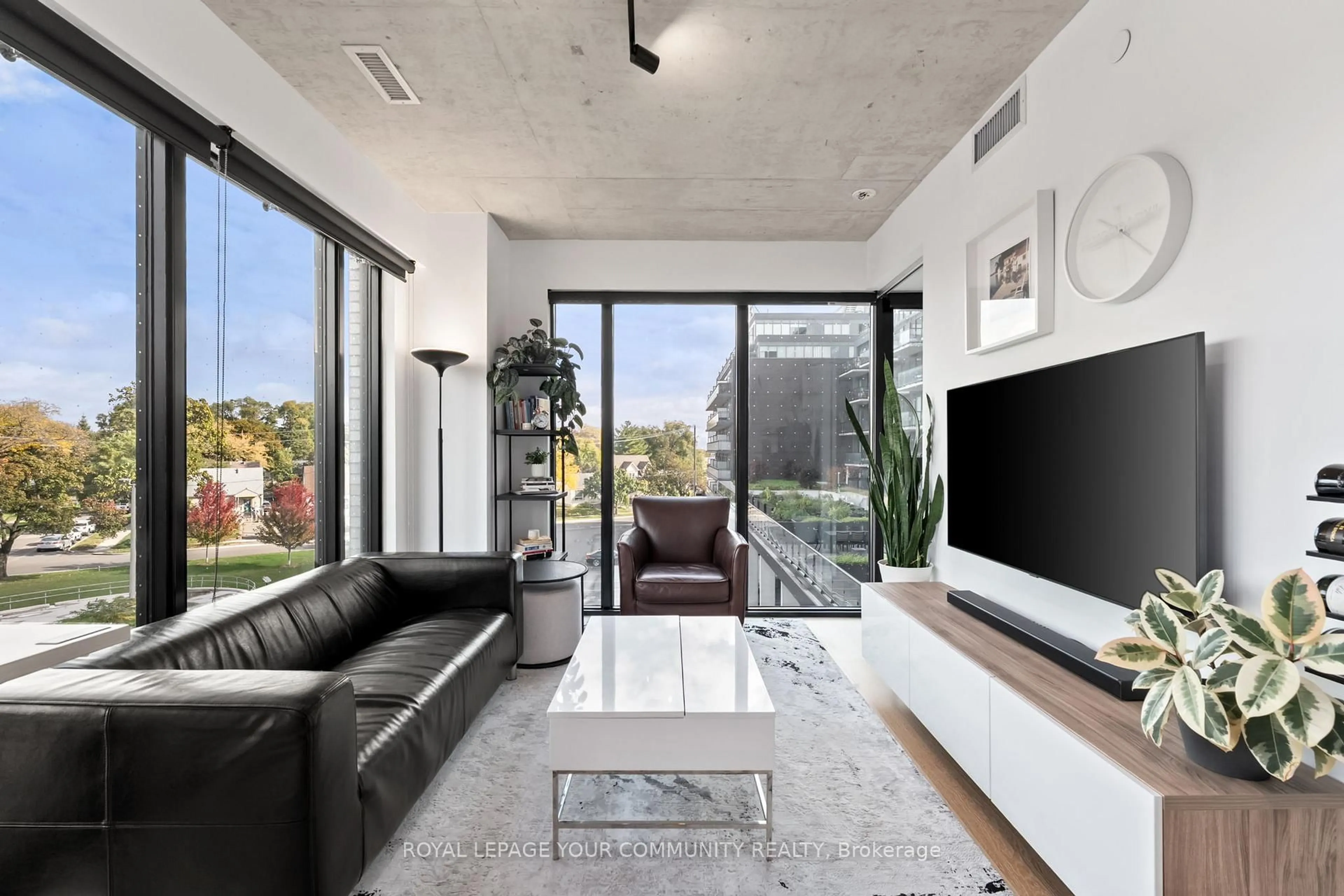 Living room with furniture, cement floor for 7 Smith Cres #325, Toronto Ontario M8Z 0G3