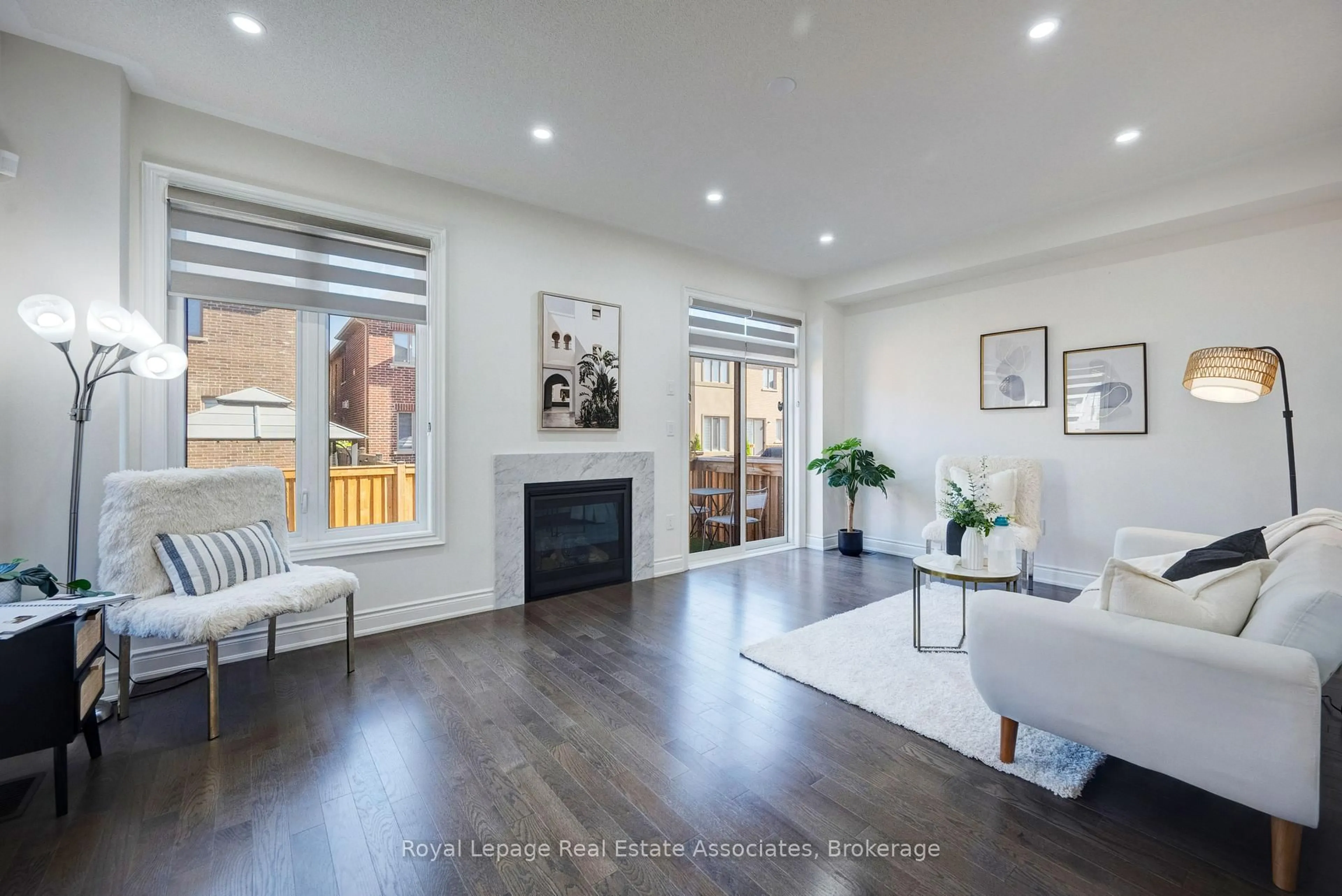 Living room with furniture, wood/laminate floor for 13 Quinton Rdge, Brampton Ontario L6Y 6J4