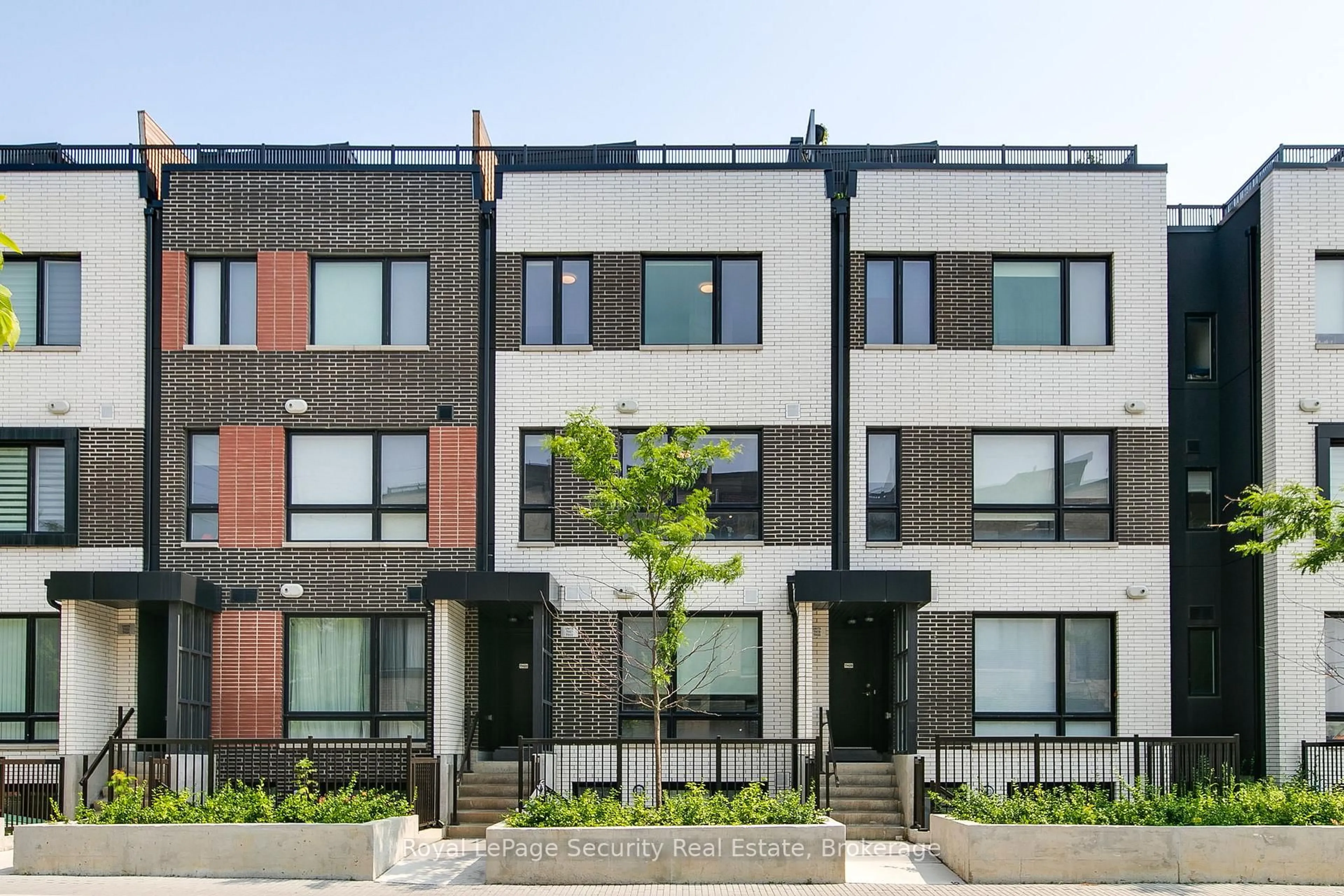 Home with brick exterior material, street for 40 Ed Clark Gdns #TH 22, Toronto Ontario M6N 0B5