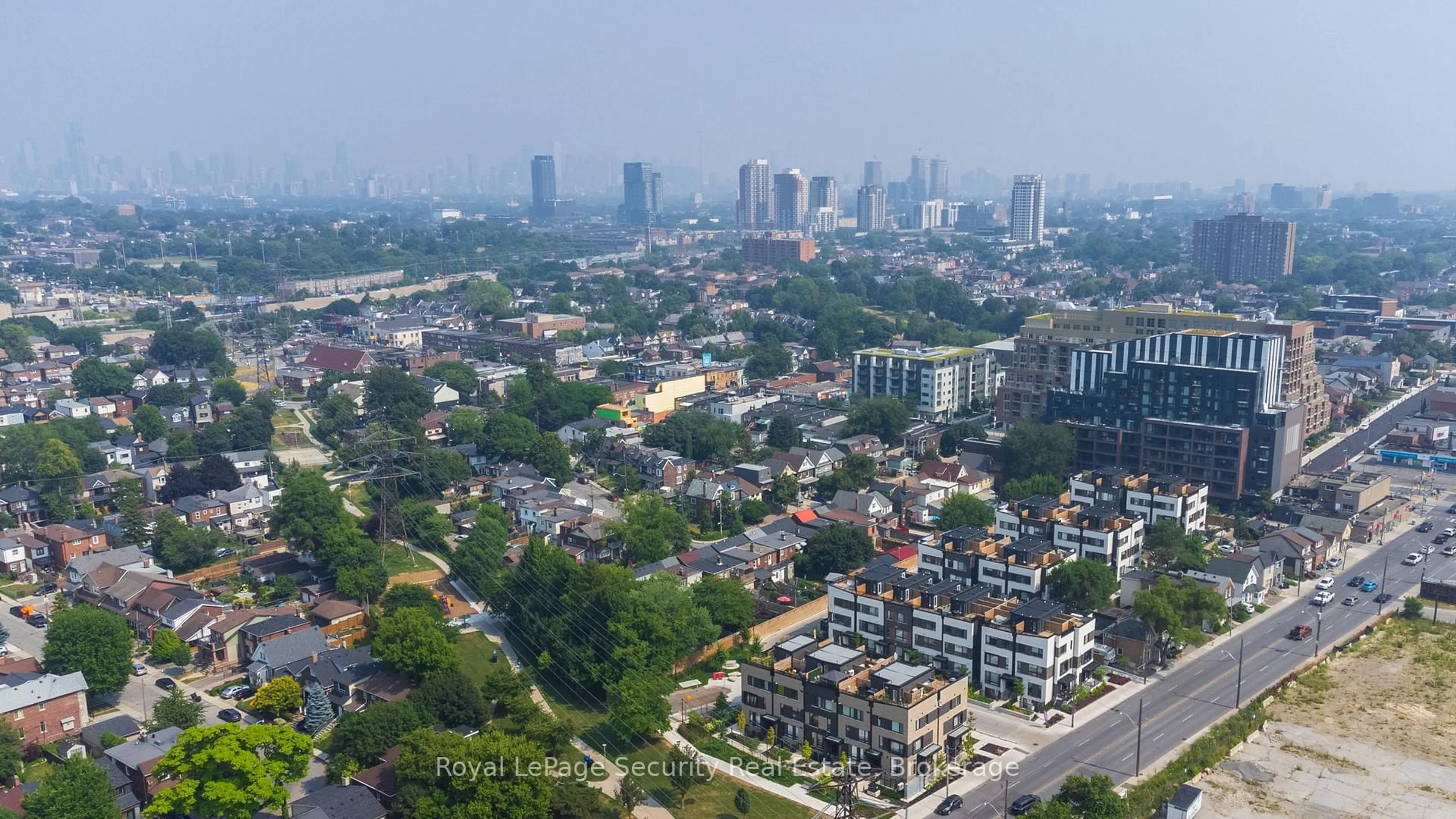 A pic from outside/outdoor area/front of a property/back of a property/a pic from drone, city buildings view from balcony for 40 Ed Clark Gdns #TH 22, Toronto Ontario M6N 0B5