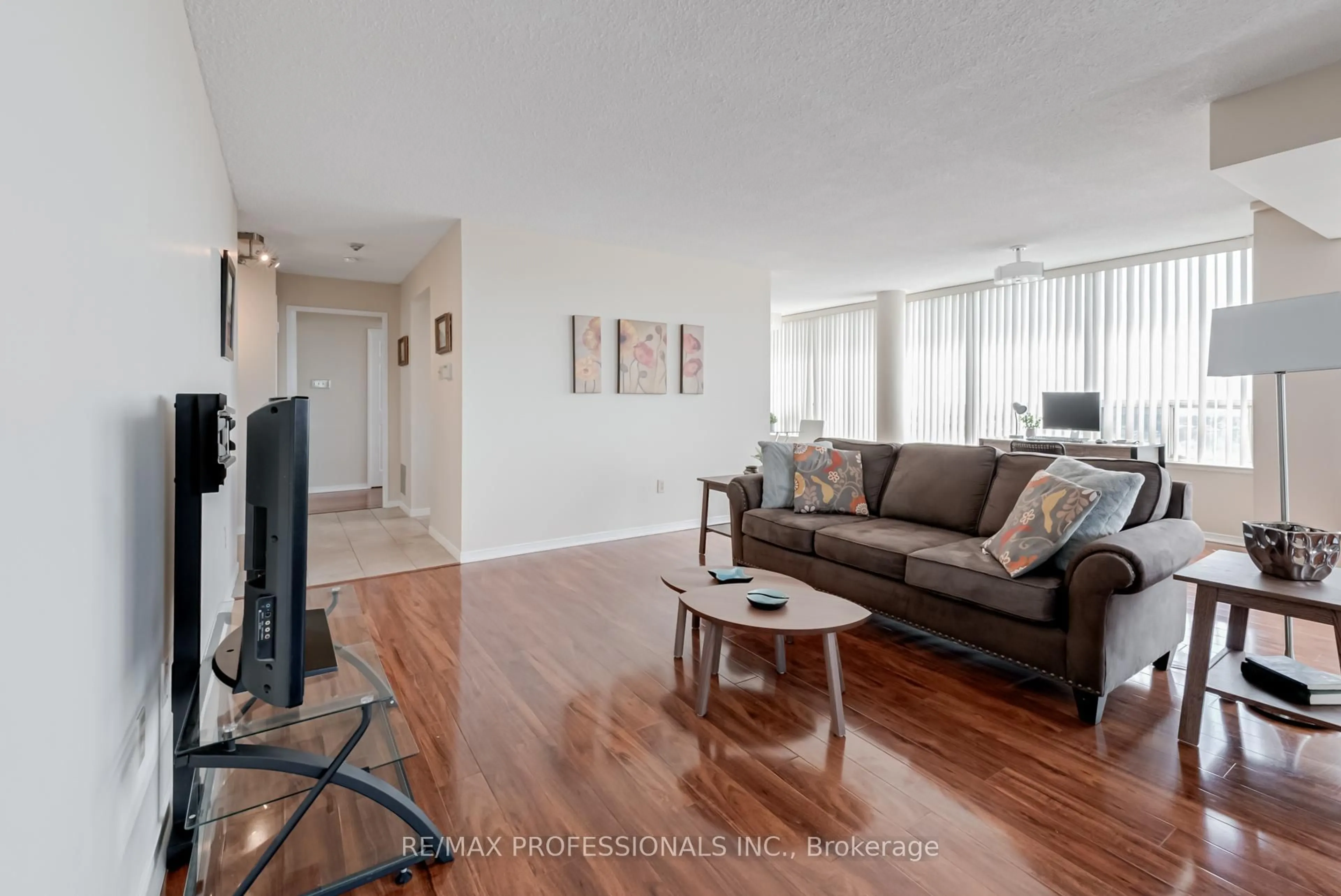 Living room with furniture, wood/laminate floor for 700 Constellation Dr #1703, Mississauga Ontario L5R 3G8
