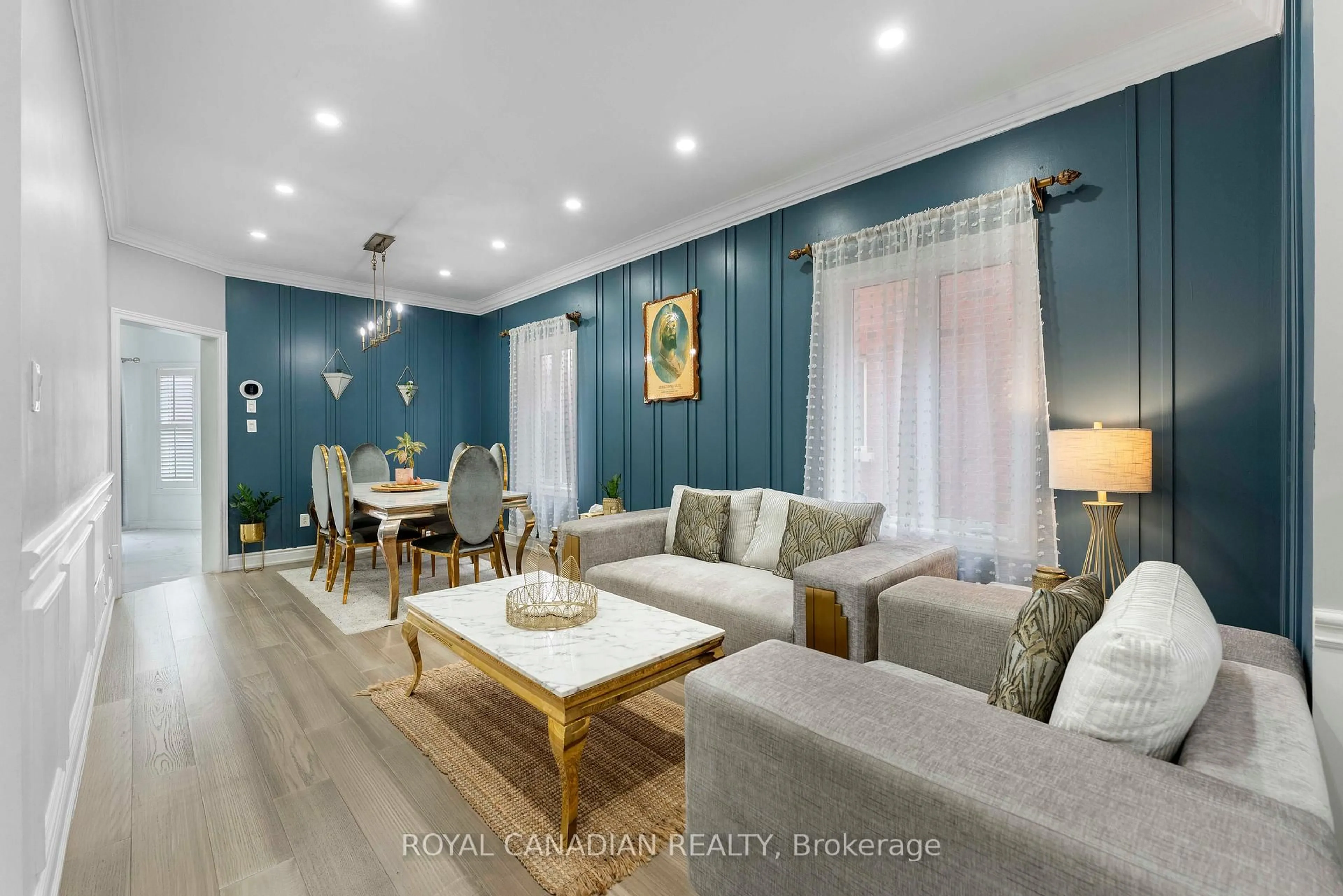 Living room with furniture, wood/laminate floor for 88 Olde Town Rd, Brampton Ontario L6X 4X9