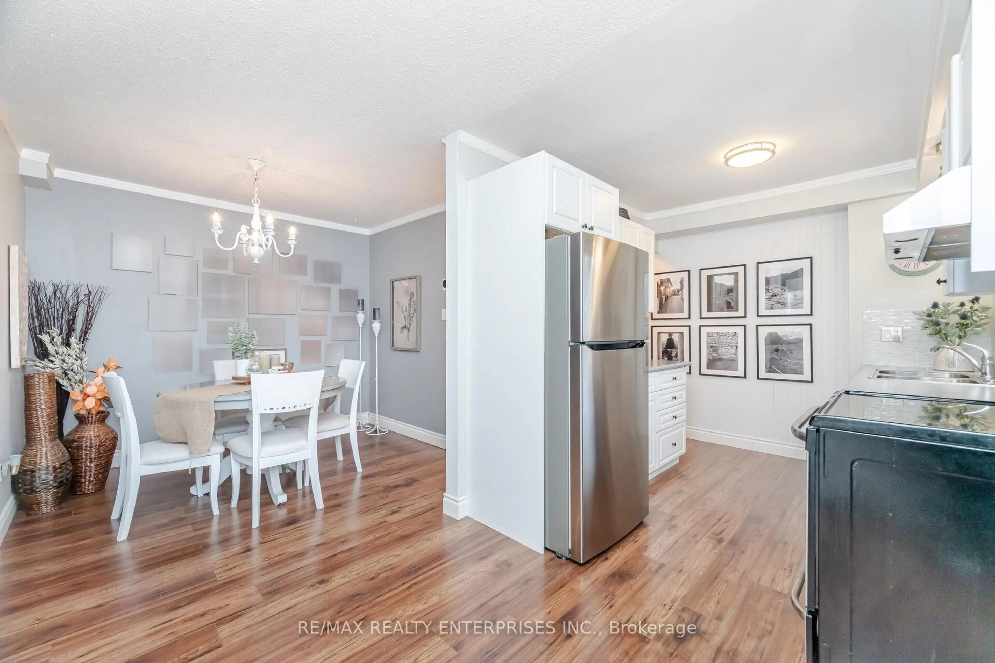 Open concept kitchen, wood/laminate floor for 371 Bronte St #110, Milton Ontario L9T 3K5