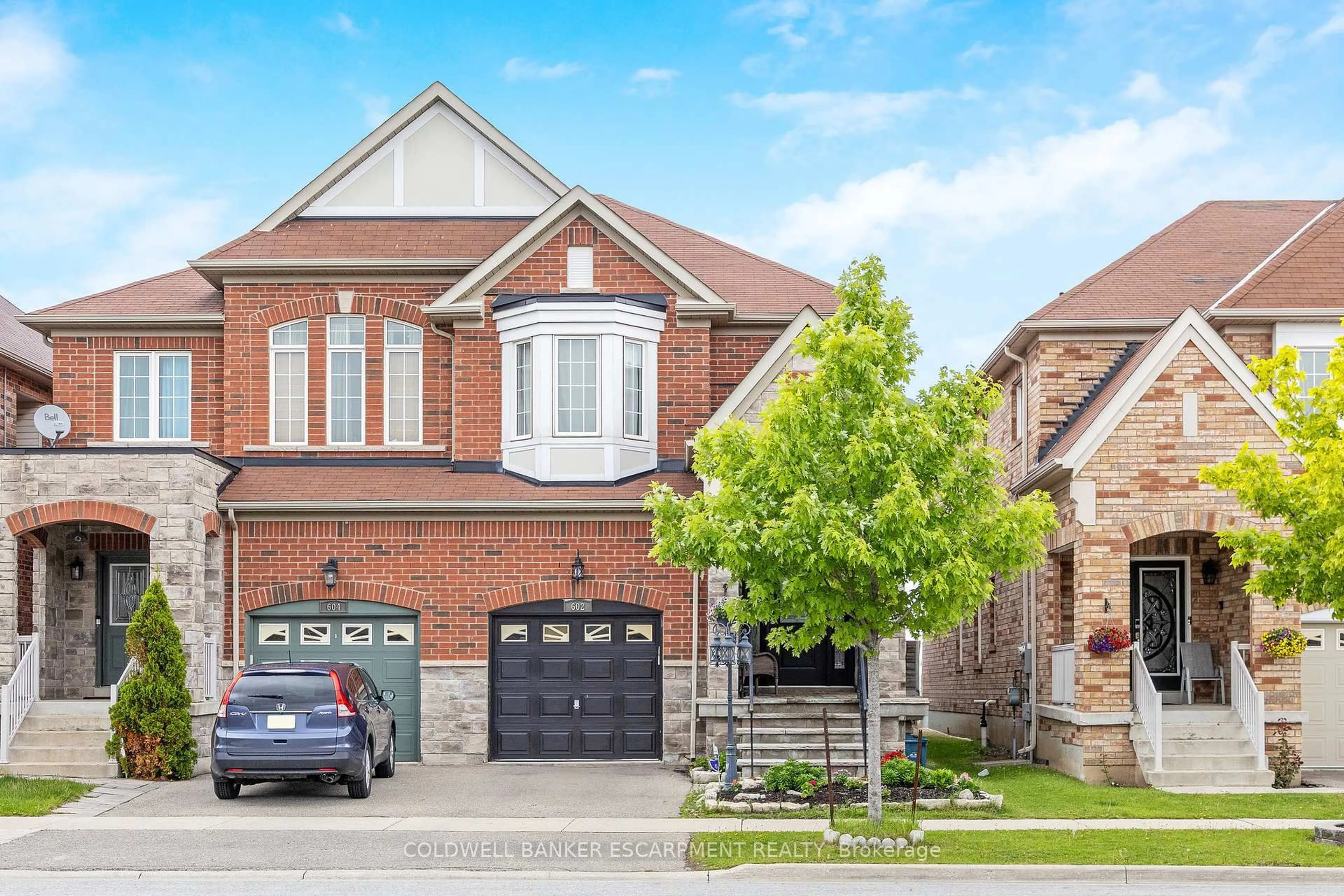 Home with brick exterior material, street for 602 Yates Dr, Milton Ontario L9T 7R1
