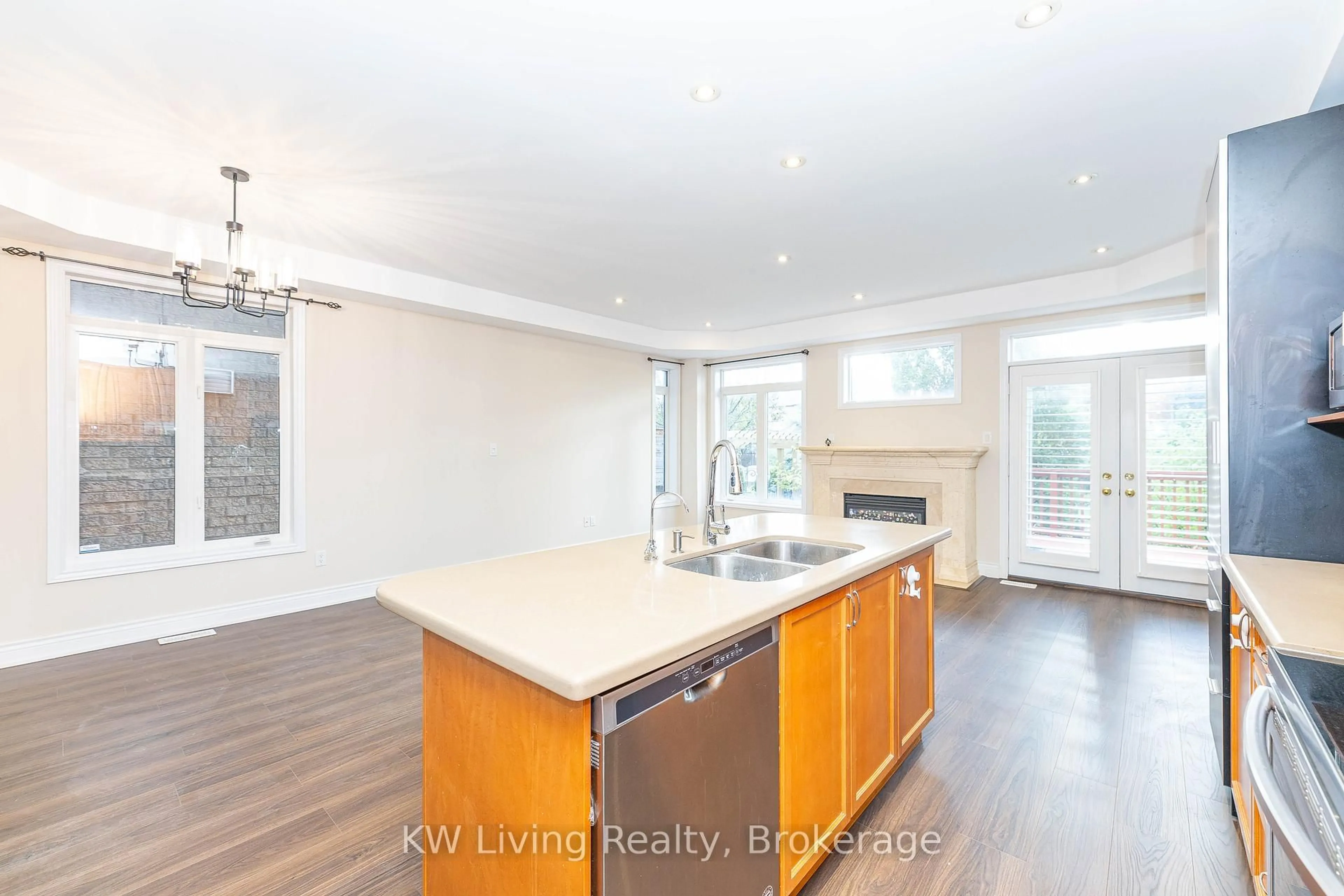 Open concept kitchen, wood/laminate floor for 1182 Woodington Lane, Oakville Ontario L6H 7V1