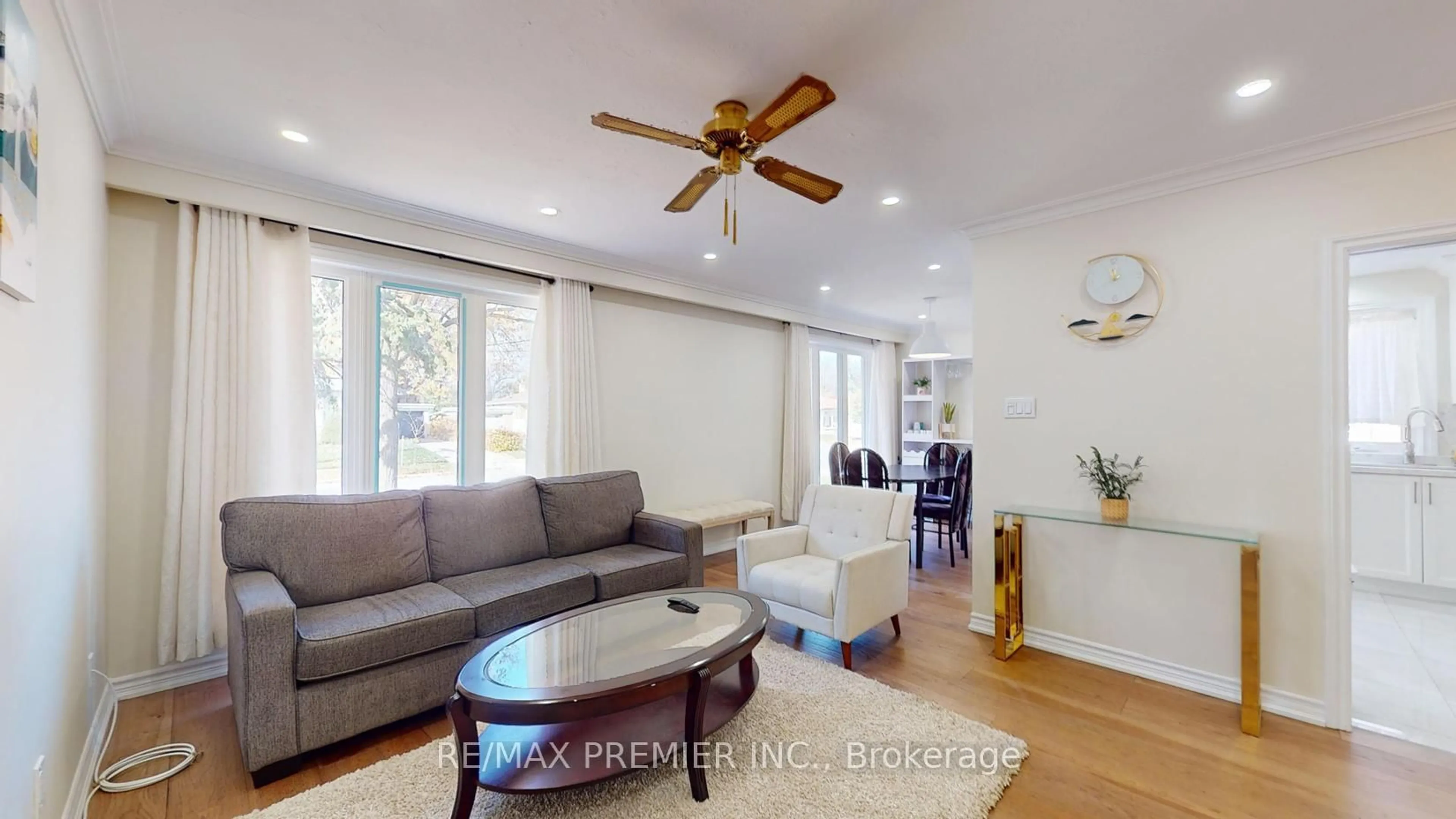 Living room with furniture, wood/laminate floor for 236 Thistle Down Blvd, Toronto Ontario M9V 1K7