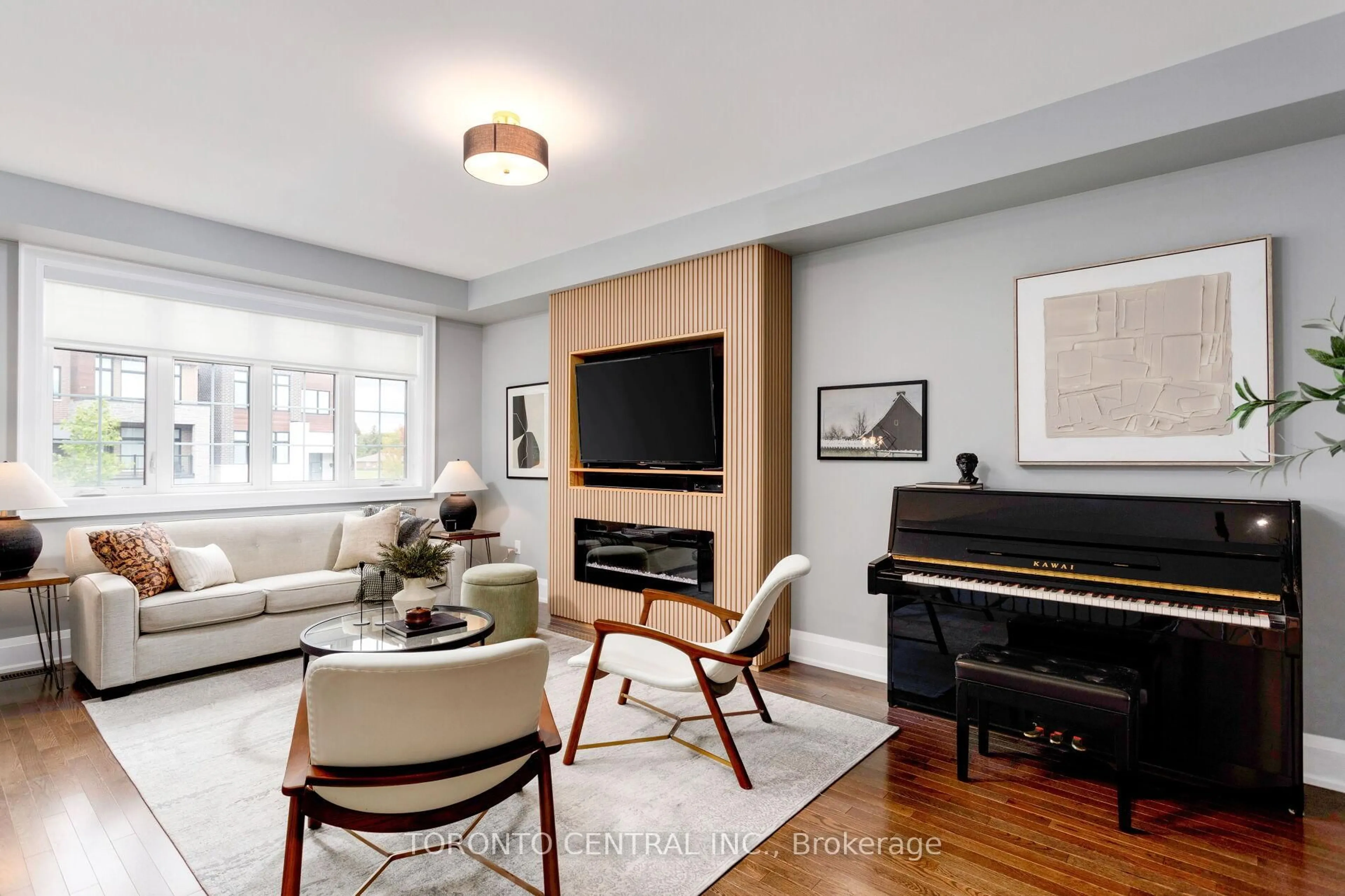 Living room with furniture, wood/laminate floor for 9 Chimney Swift Crt, Toronto Ontario M9B 0C6