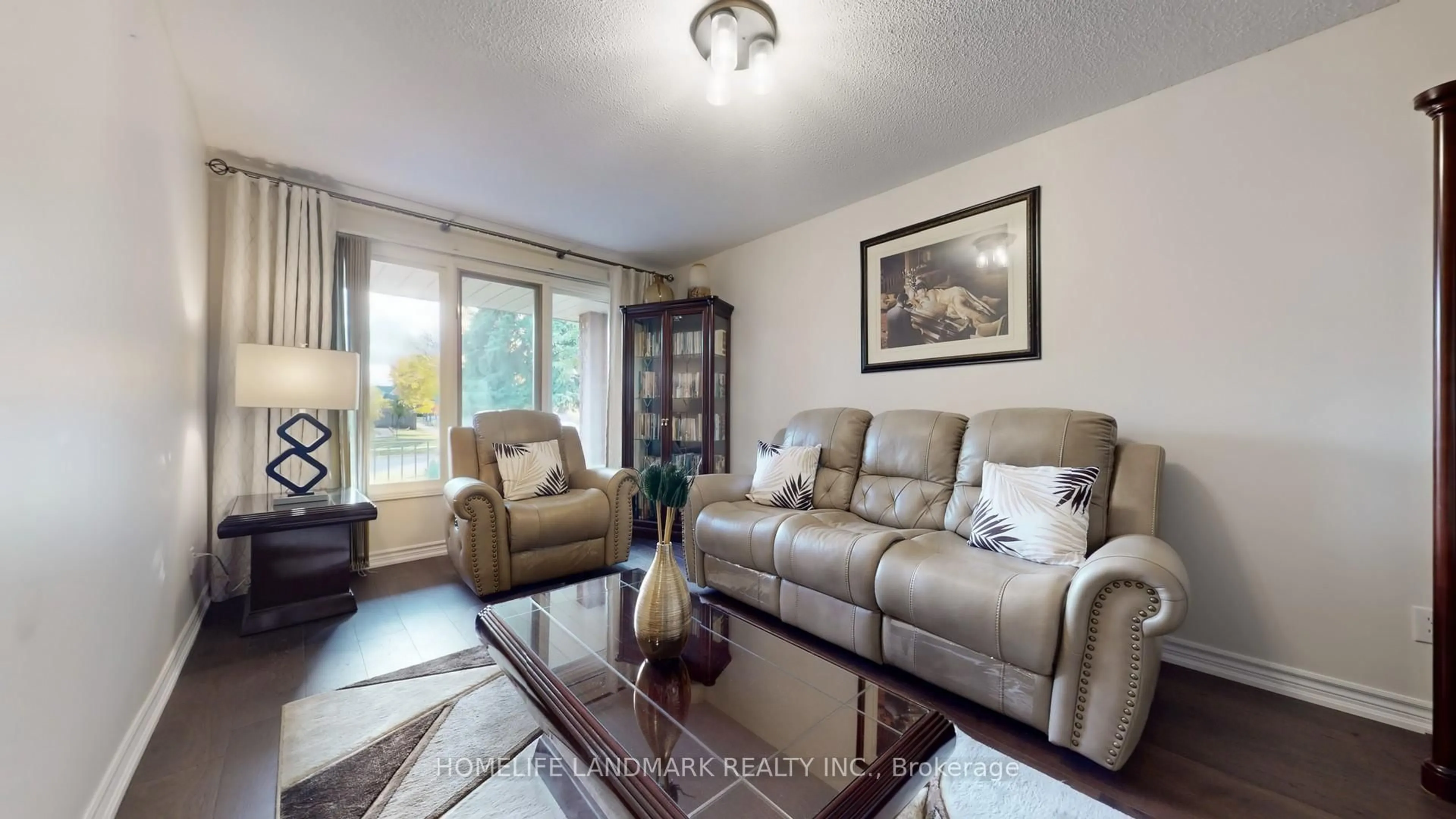 Living room with furniture, wood/laminate floor for 4497 Longmoor Rd, Mississauga Ontario L5M 4H6