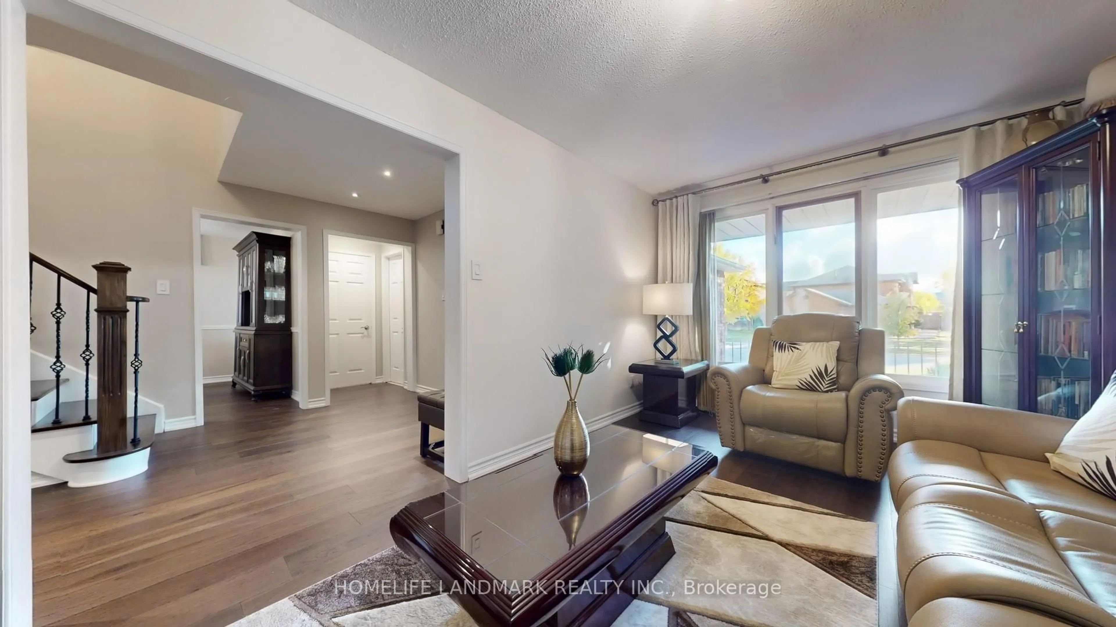 Living room with furniture, wood/laminate floor for 4497 Longmoor Rd, Mississauga Ontario L5M 4H6