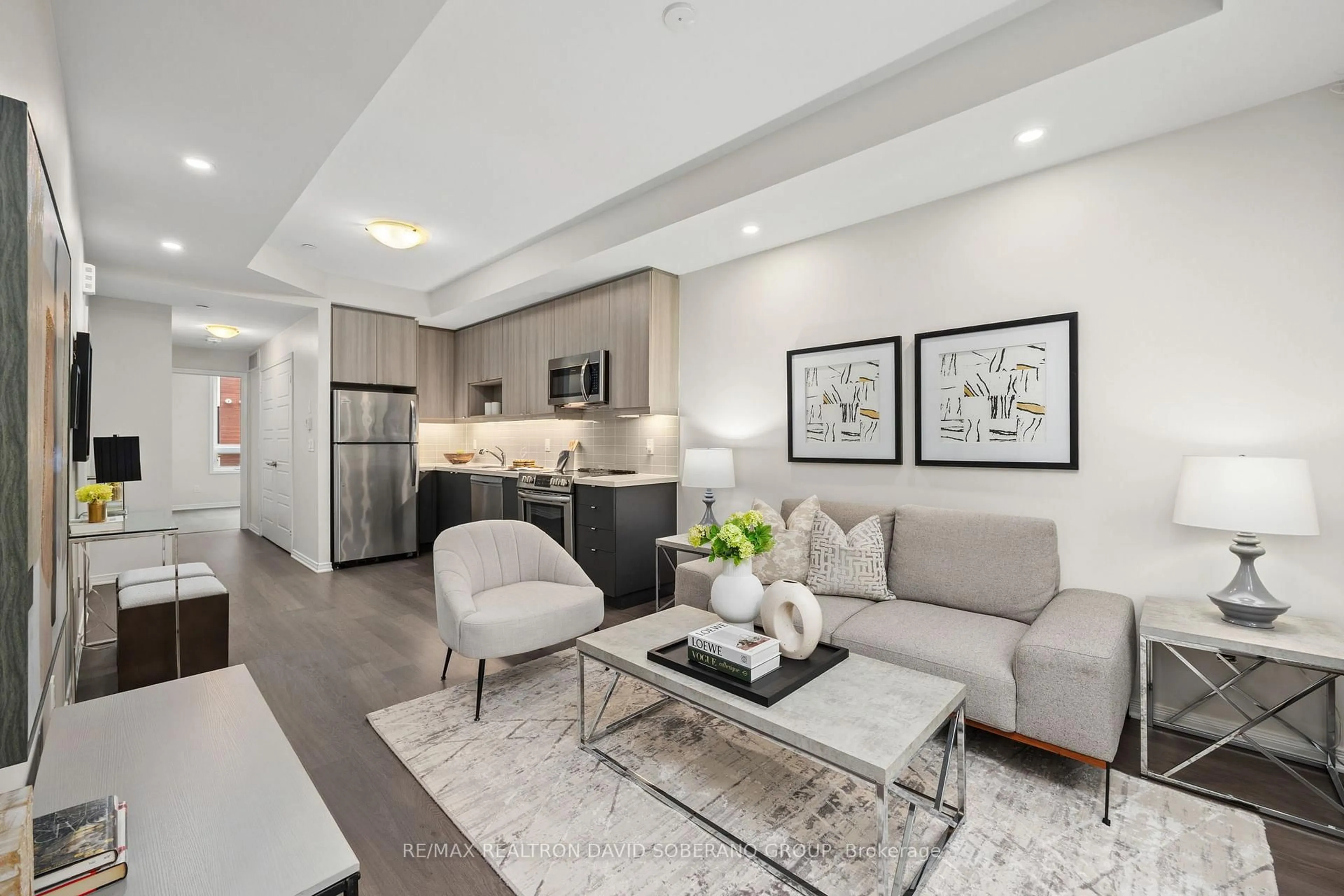 Living room with furniture, unknown for 1120 Briar Hill Ave #202, Toronto Ontario M6B 0A9