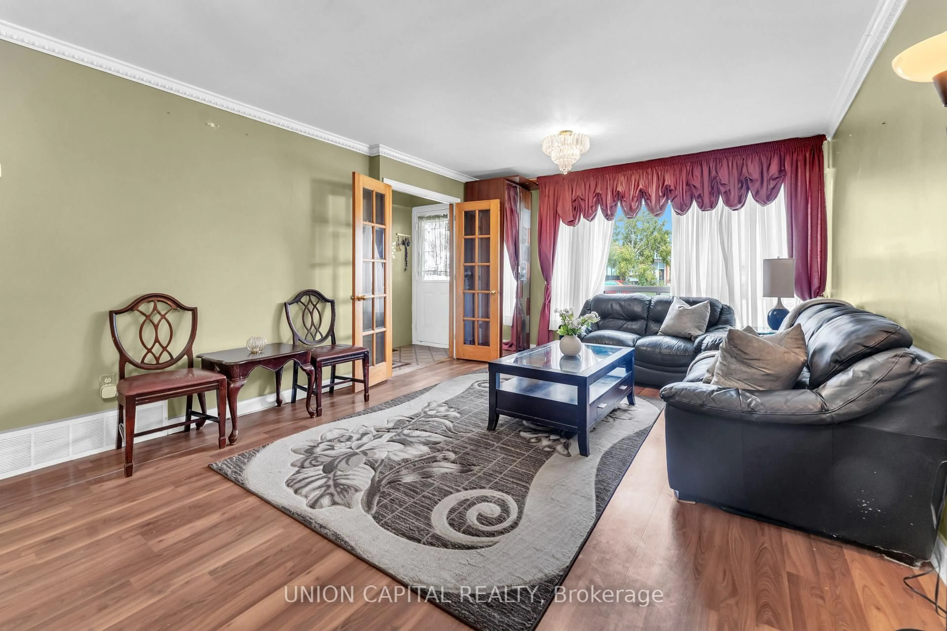 Living room with furniture, wood/laminate floor for 19 Ava Crt, Brampton Ontario L6T 1L5
