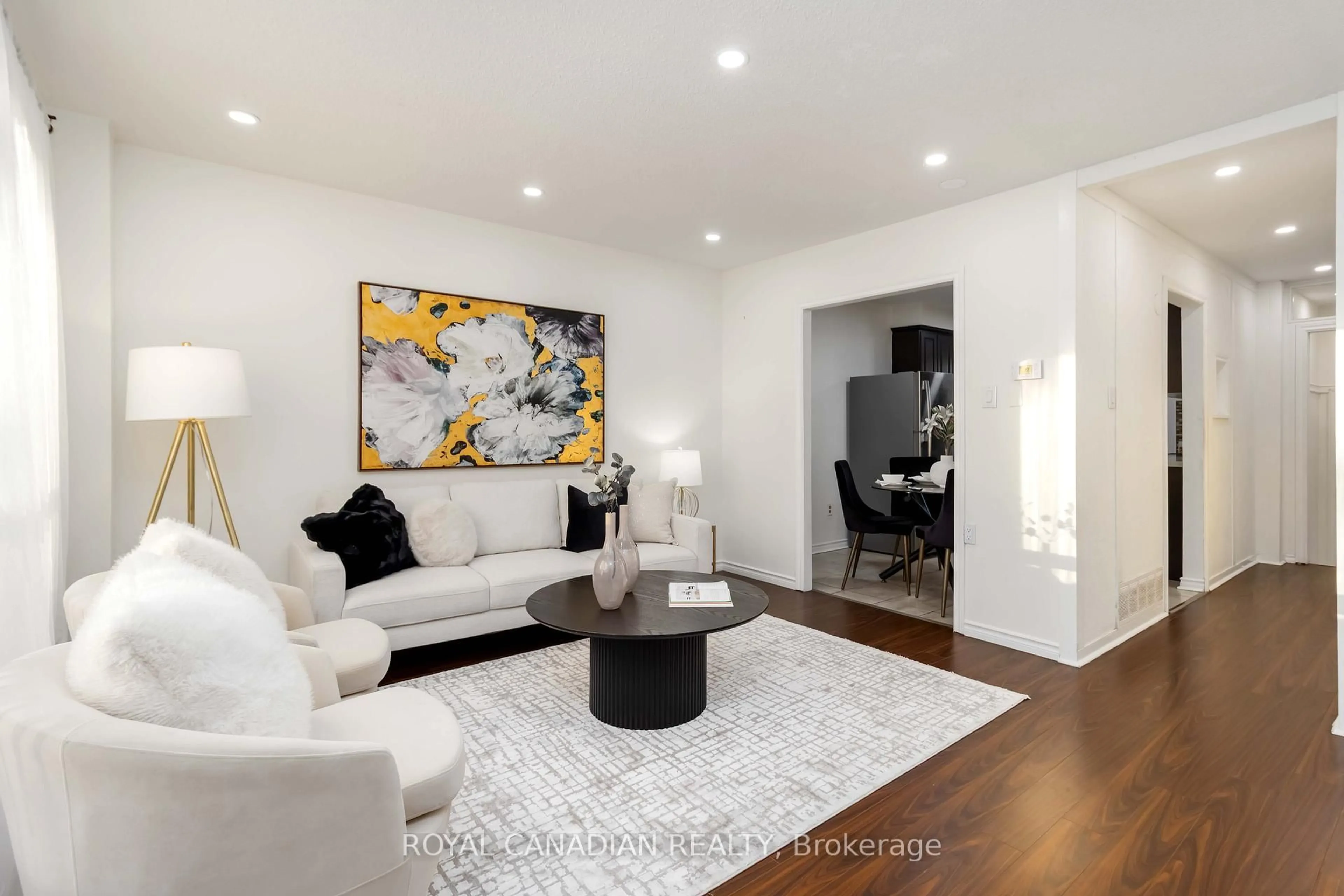 Living room with furniture, wood/laminate floor for 475 Bramalea Rd #106, Brampton Ontario L6T 2X2