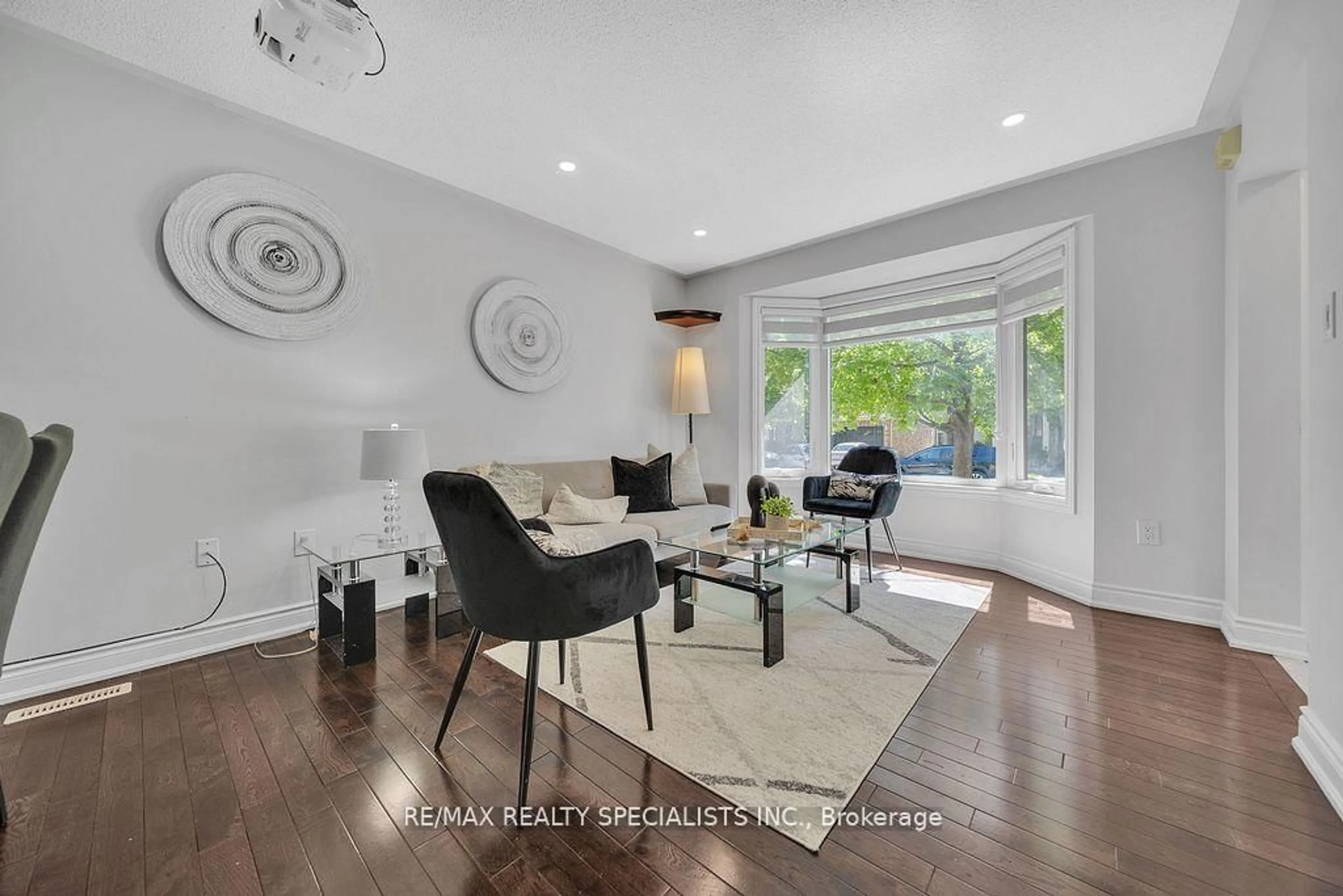 Living room with furniture, wood/laminate floor for 22 Clayborne Ave, Brampton Ontario L7A 1N8