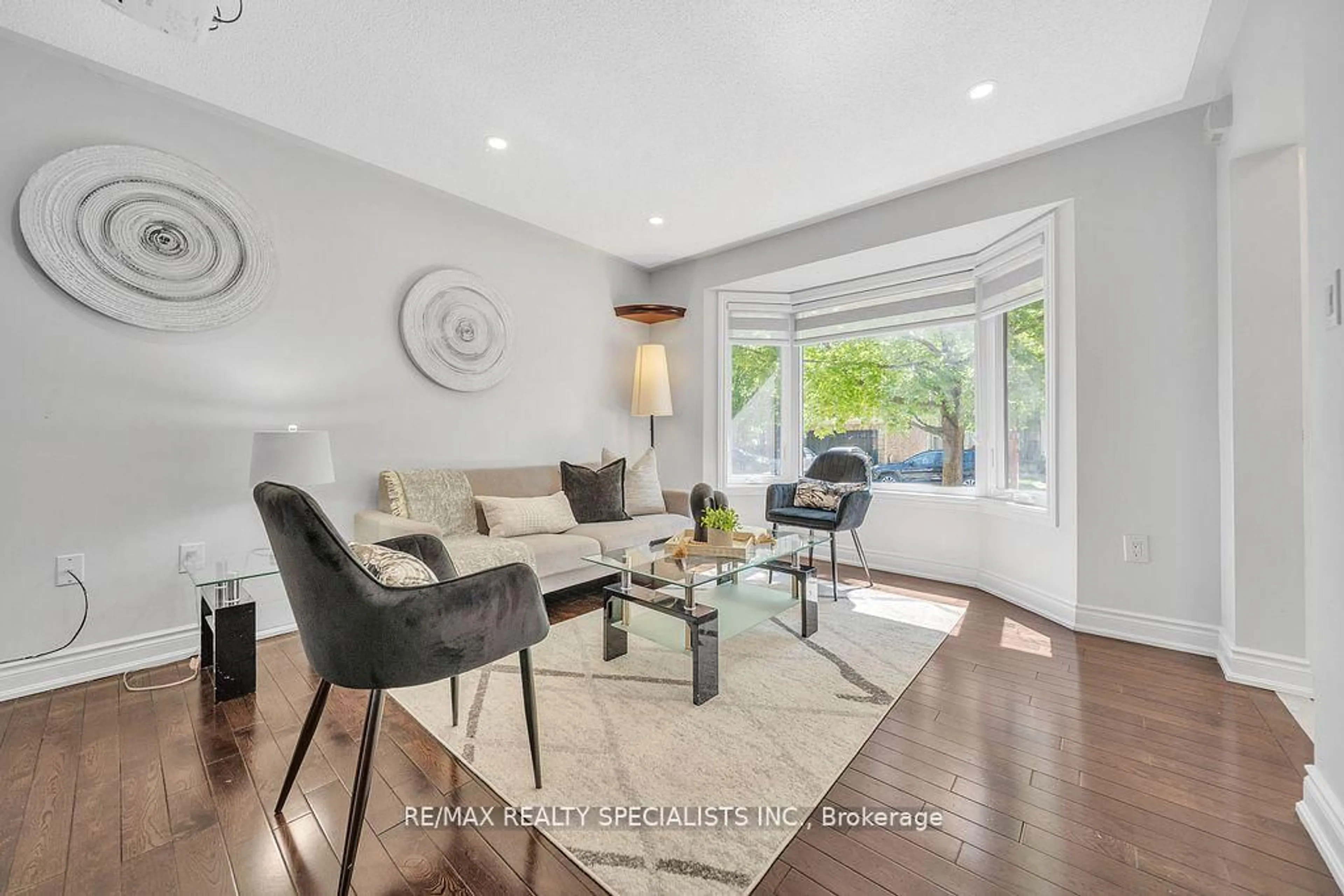 Living room with furniture, wood/laminate floor for 22 Clayborne Ave, Brampton Ontario L7A 1N8