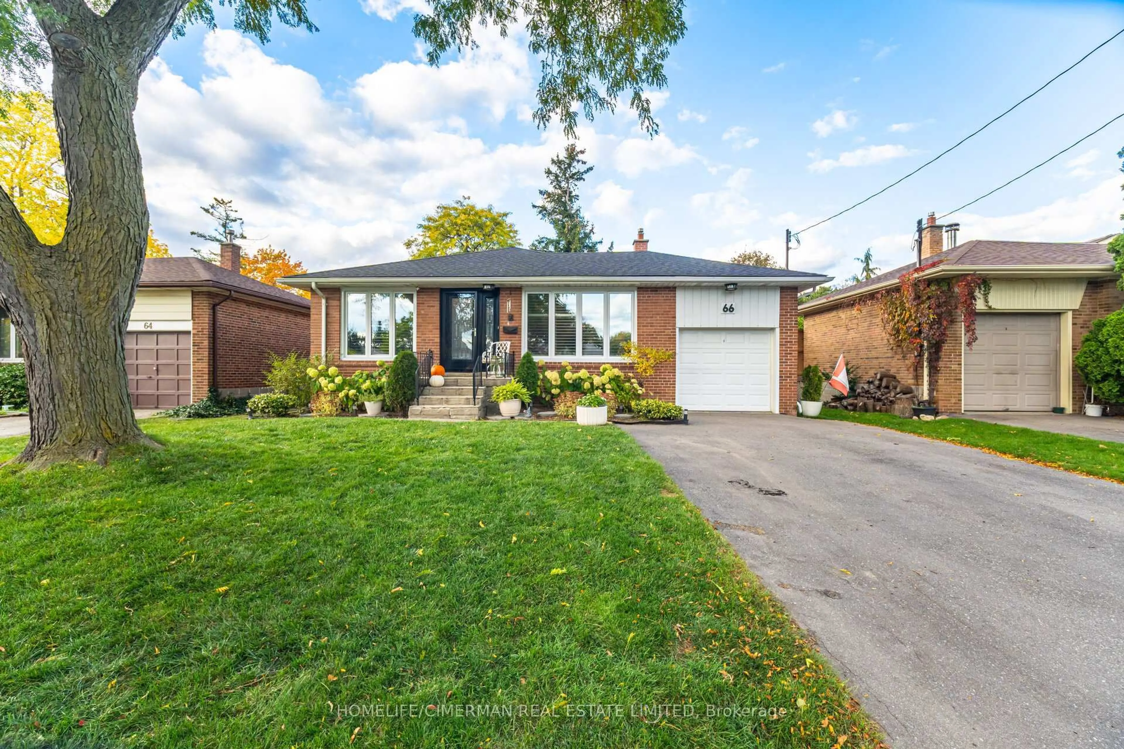 Home with brick exterior material, street for 66 Mooreshead Dr, Toronto Ontario M9C 2S3