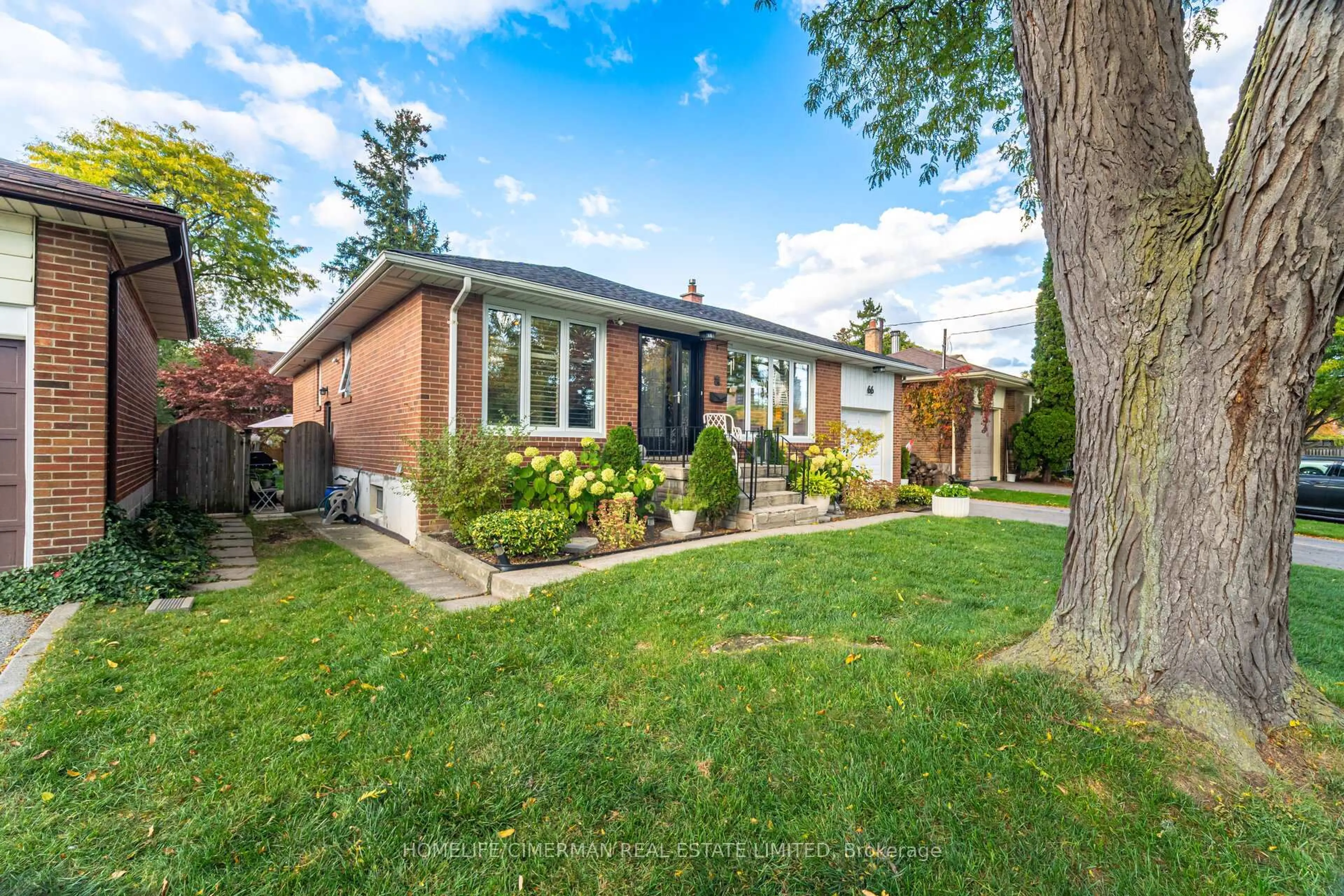 Home with brick exterior material, street for 66 Mooreshead Dr, Toronto Ontario M9C 2S3
