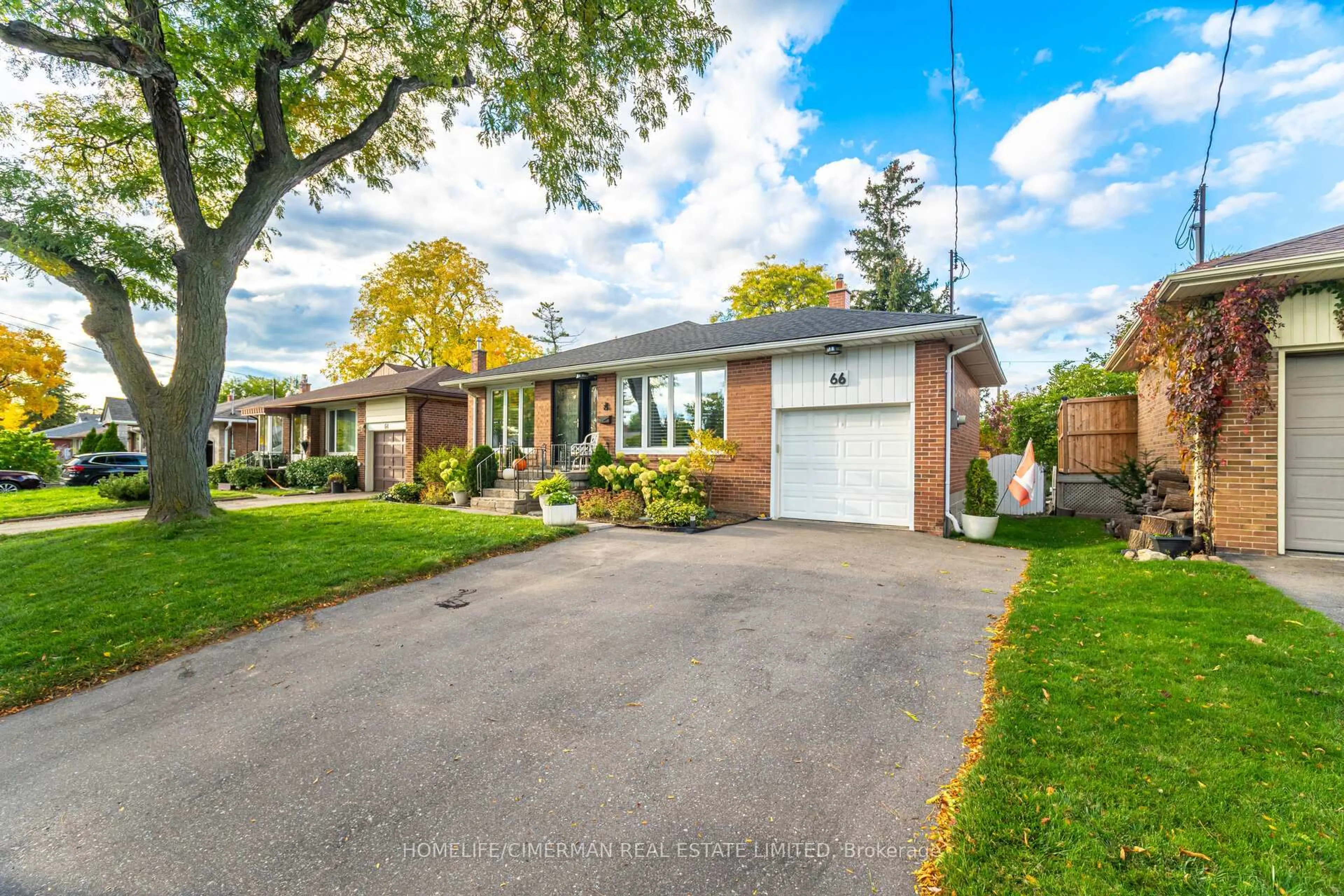 Home with brick exterior material, street for 66 Mooreshead Dr, Toronto Ontario M9C 2S3