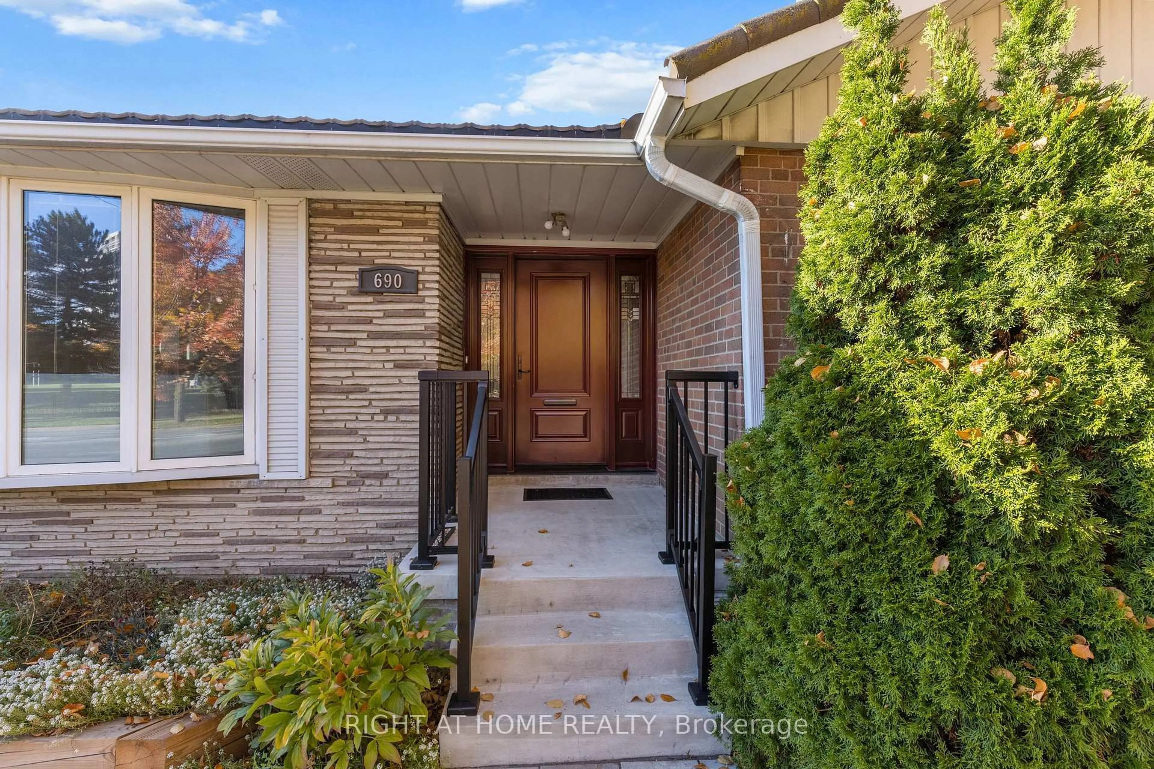 Home with brick exterior material, street for 690 The West Mall, Toronto Ontario M9C 1H3