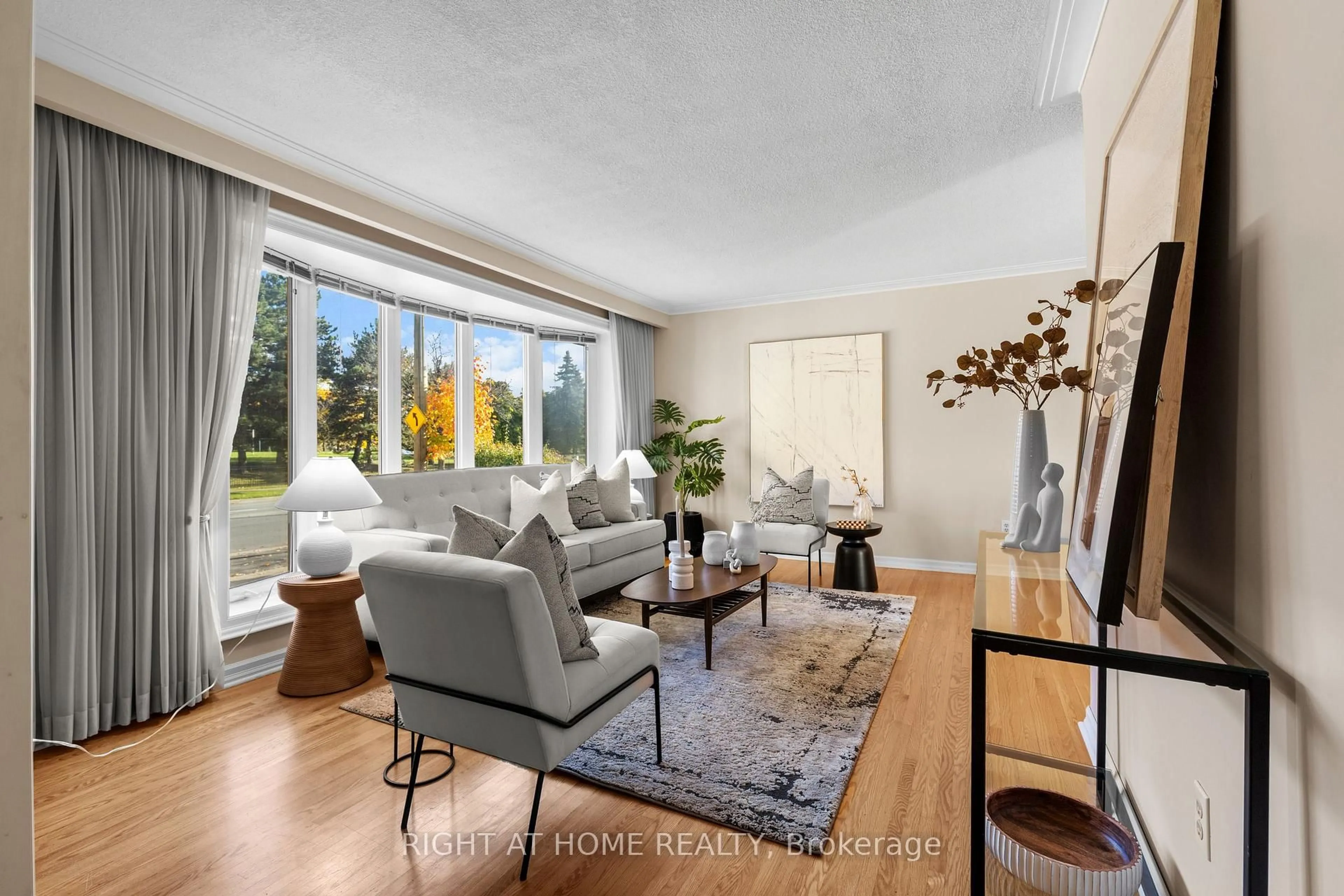 Living room with furniture, unknown for 690 The West Mall, Toronto Ontario M9C 1H3