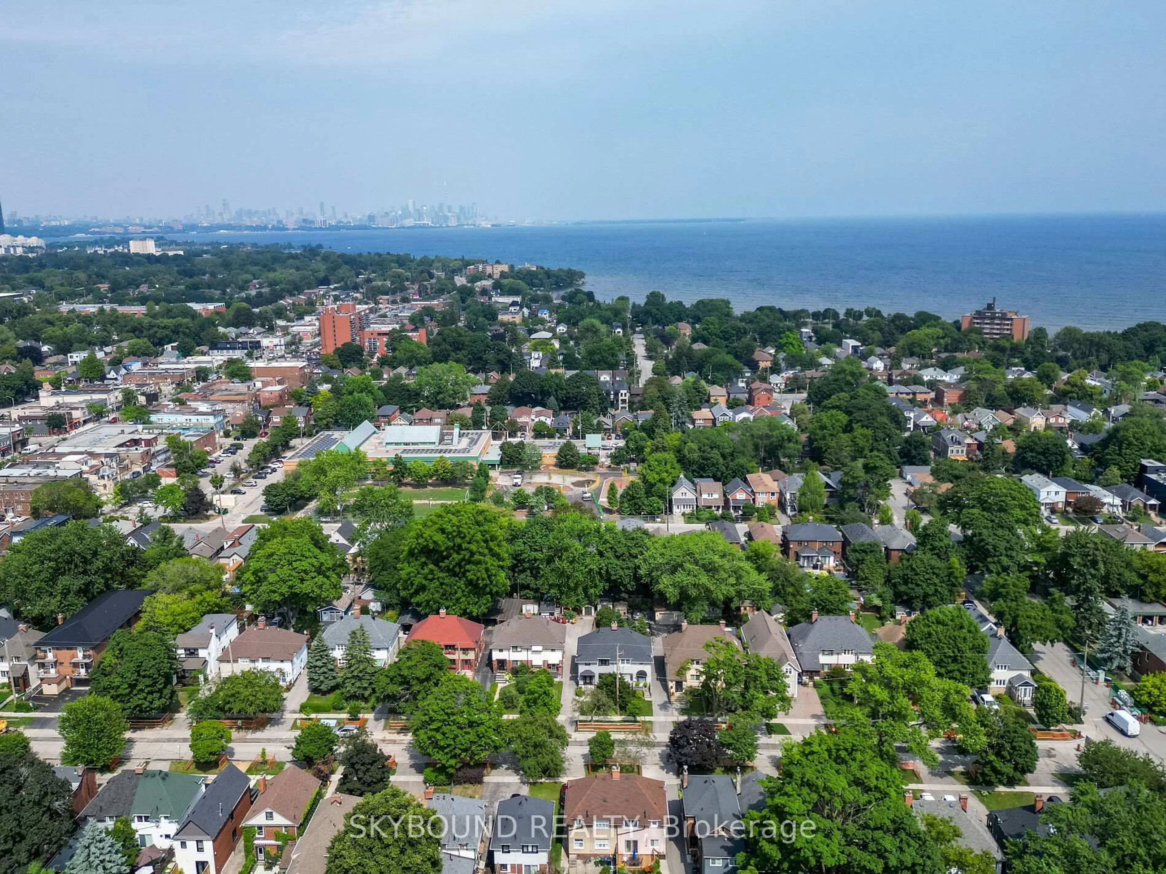A pic from outside/outdoor area/front of a property/back of a property/a pic from drone, unknown for 91 Eighth St, Toronto Ontario M8V 3C5