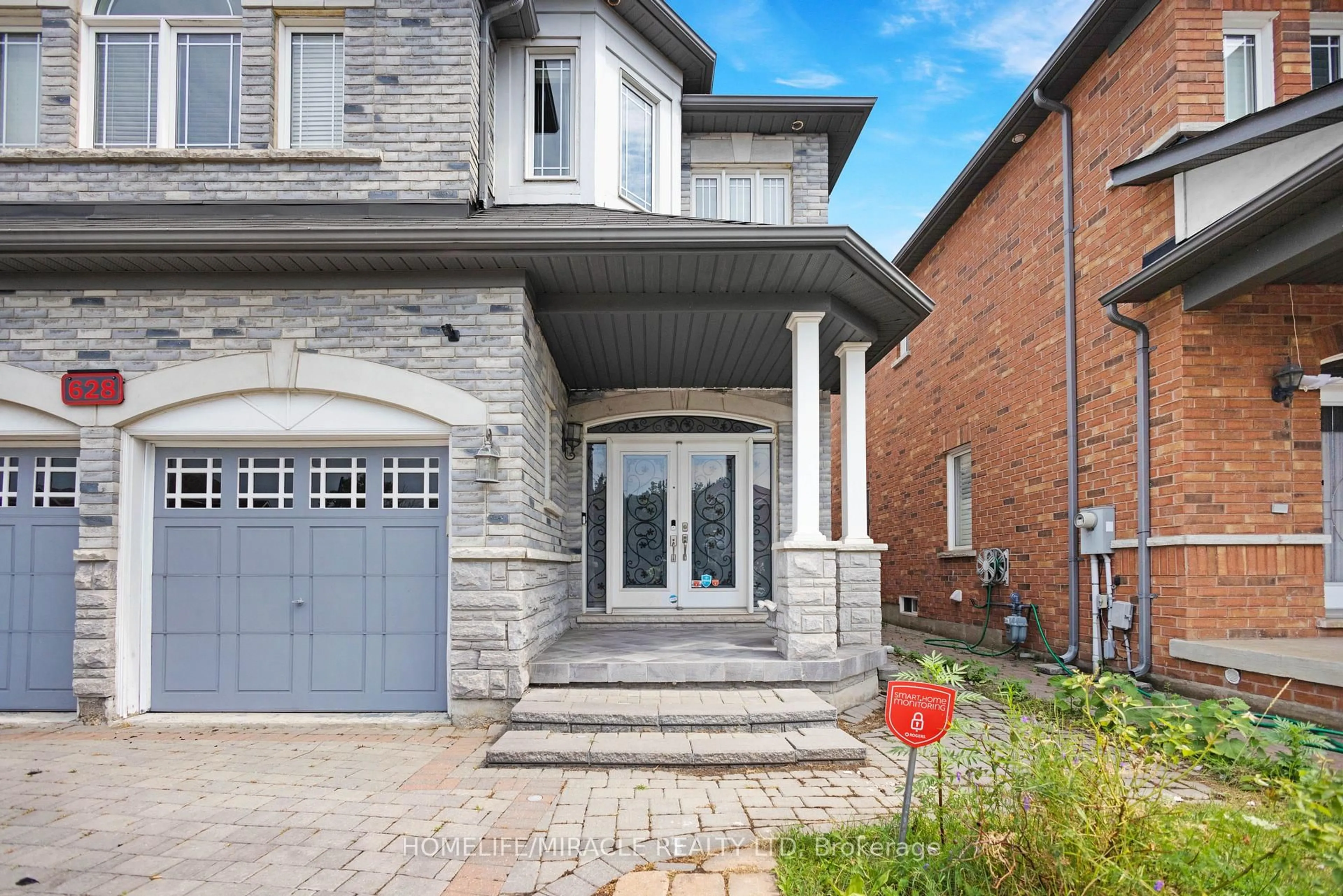 Home with brick exterior material, street for 628 Twain Ave, Mississauga Ontario L5W 0A3