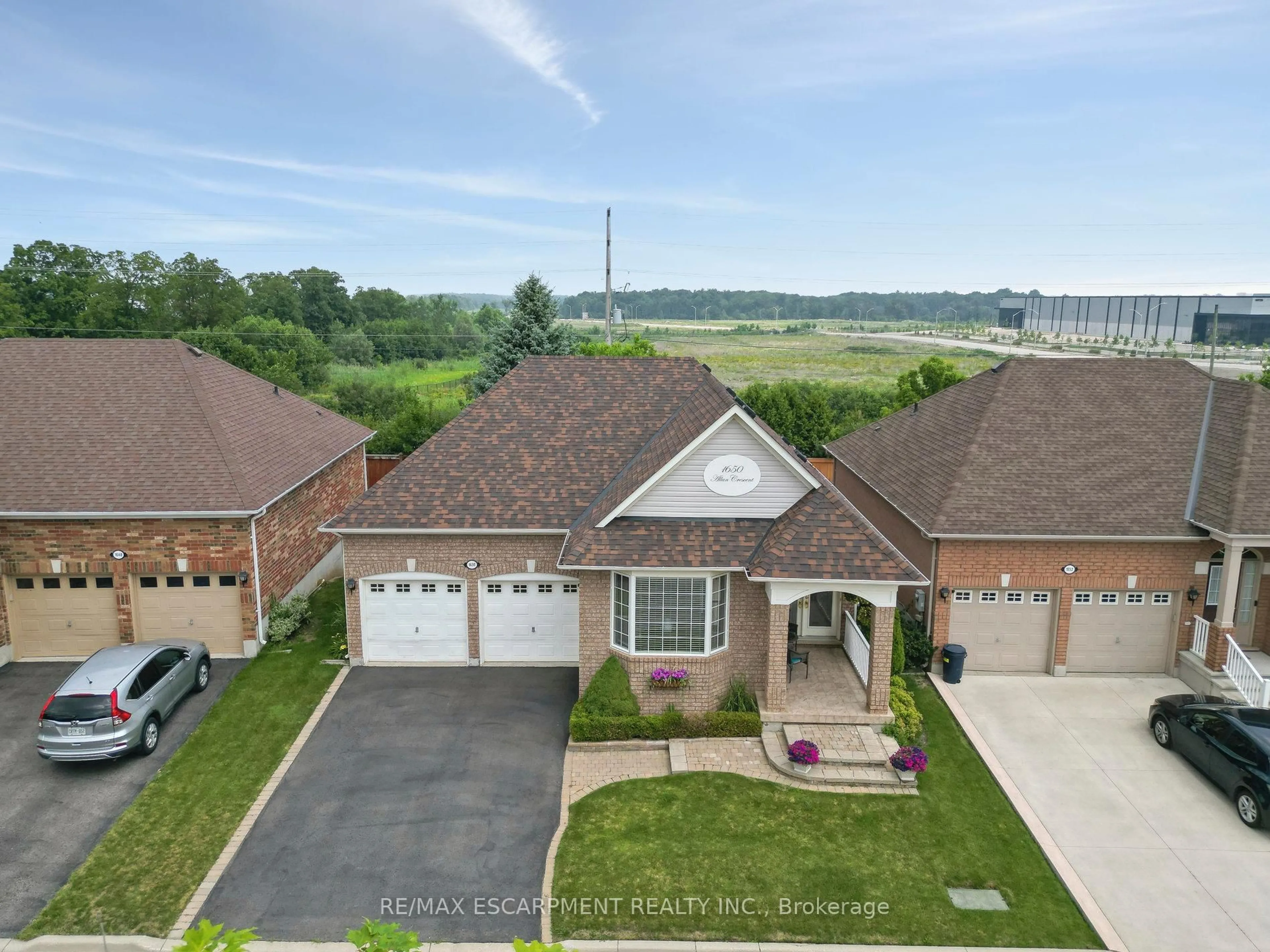 A pic from outside/outdoor area/front of a property/back of a property/a pic from drone, water/lake/river/ocean view for 1650 Allan Cres, Milton Ontario L9T 5Z7