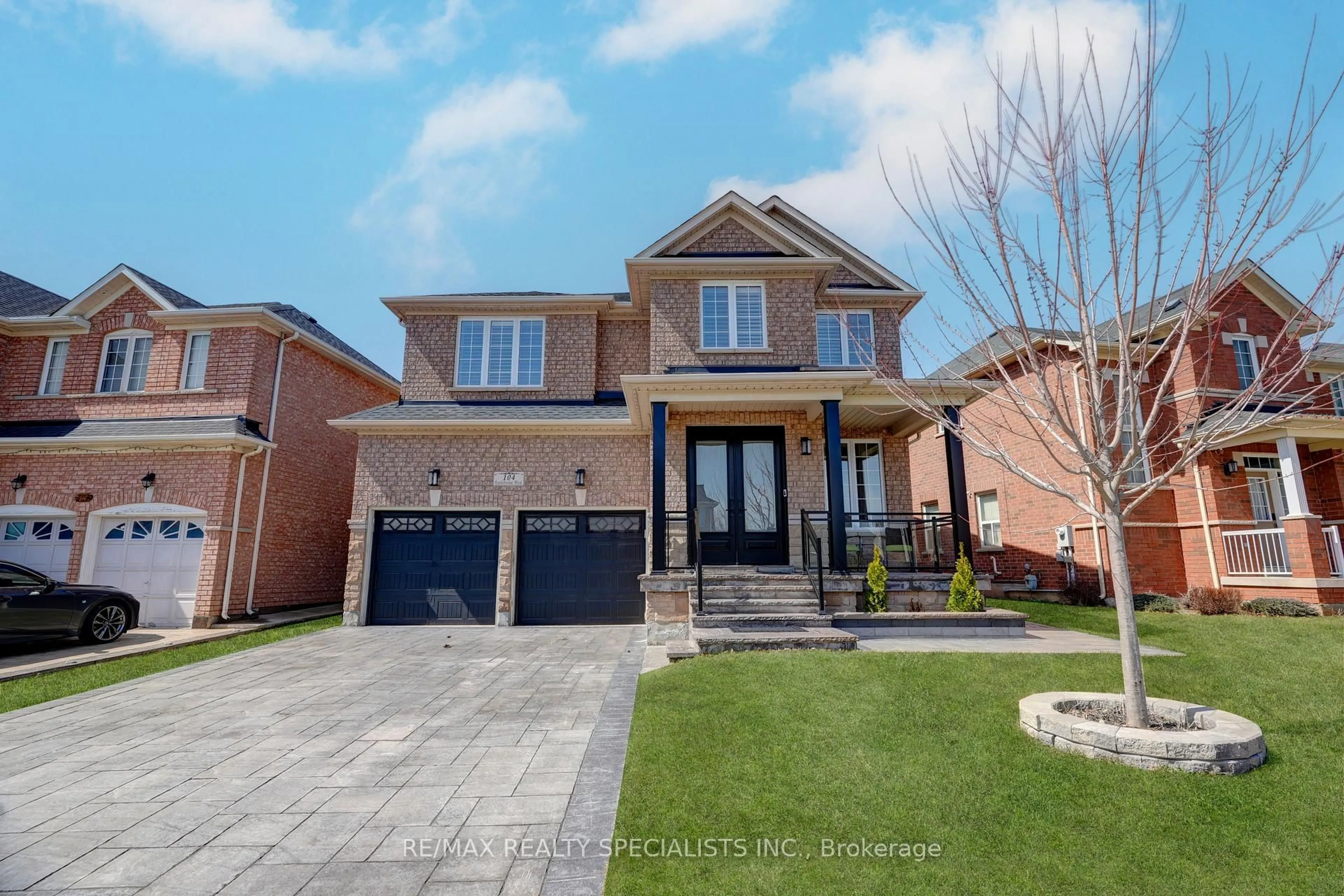 Home with brick exterior material, street for 104 Earlsbridge Blvd, Brampton Ontario L7A 3W7