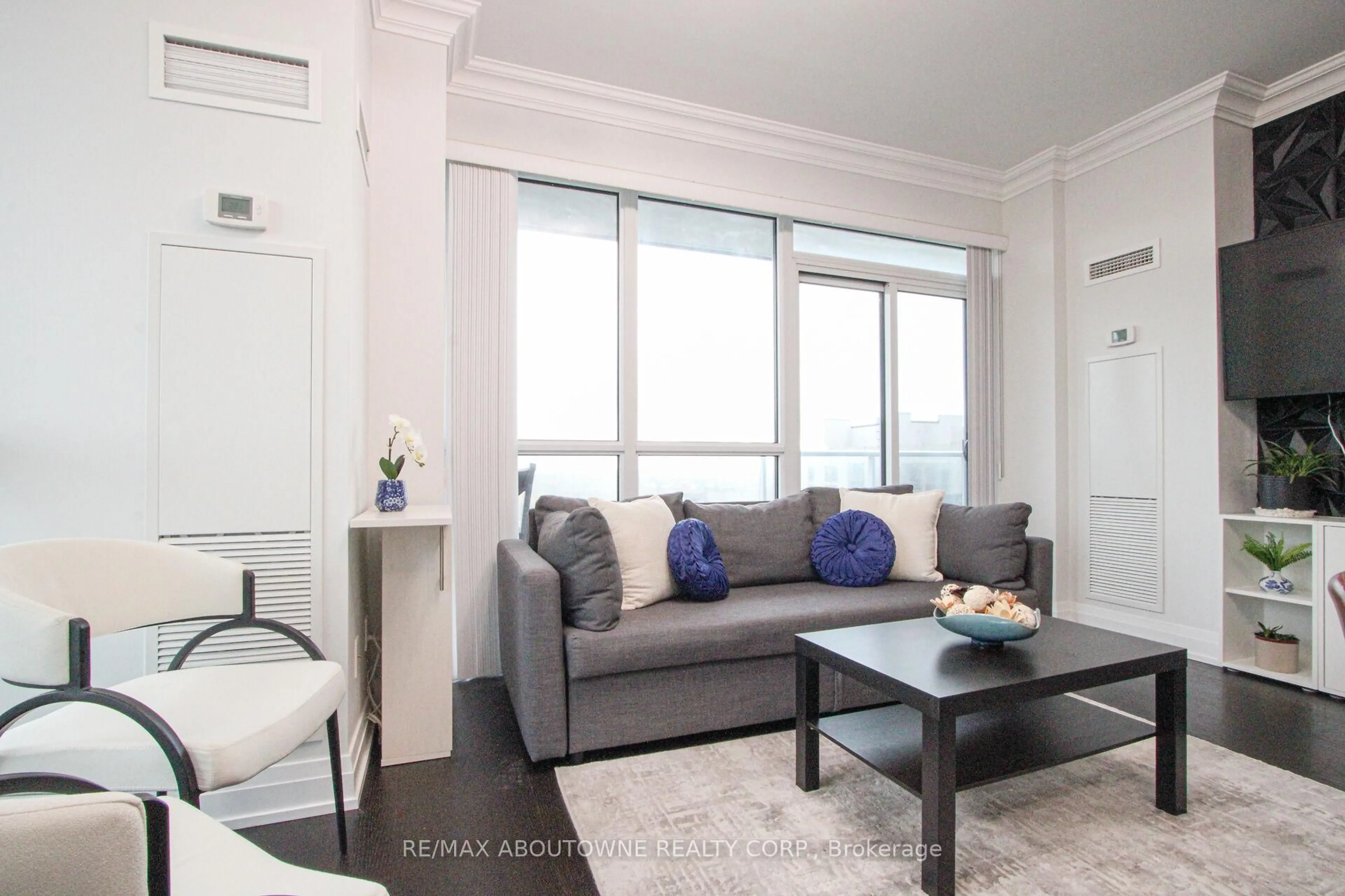 Living room with furniture, unknown for 65 Speers Rd #1503, Oakville Ontario L6K 0J1