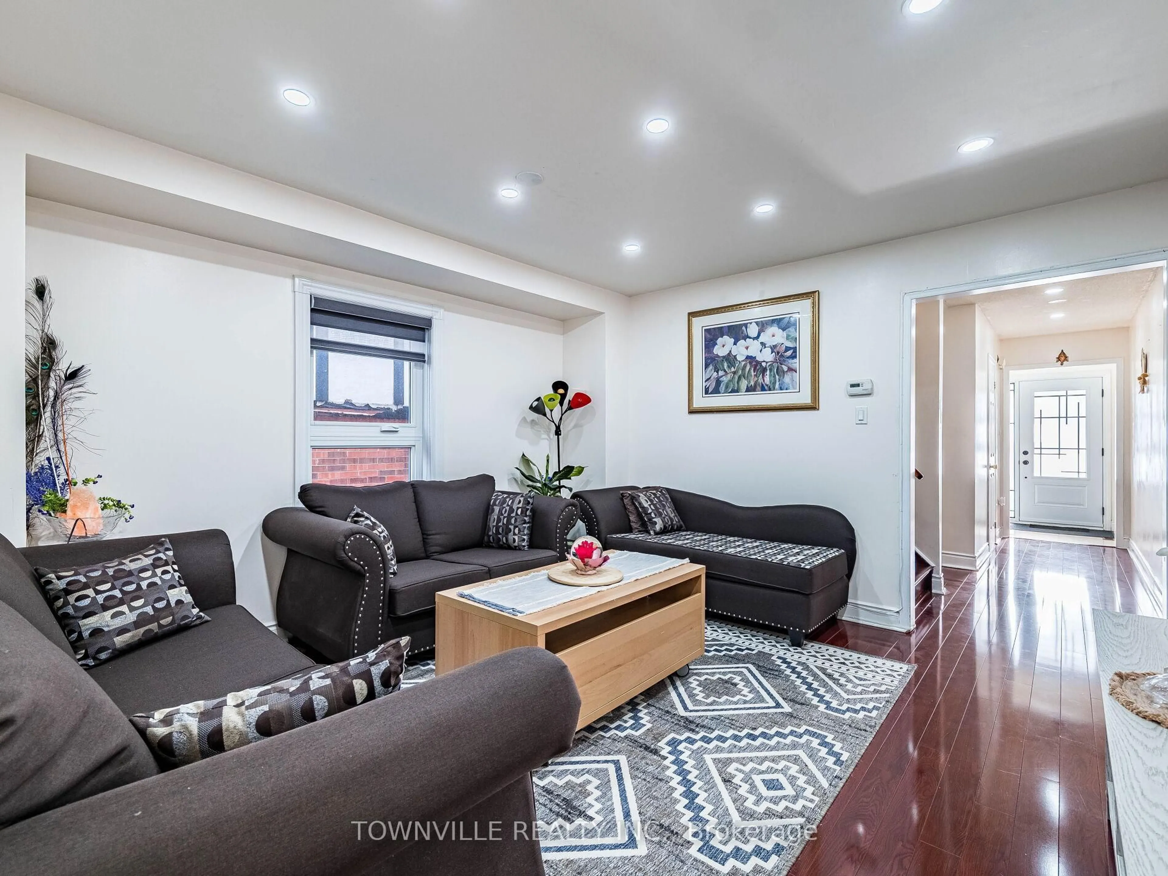 Living room with furniture, wood/laminate floor for 63 Ural Circ, Brampton Ontario L6R 1H2